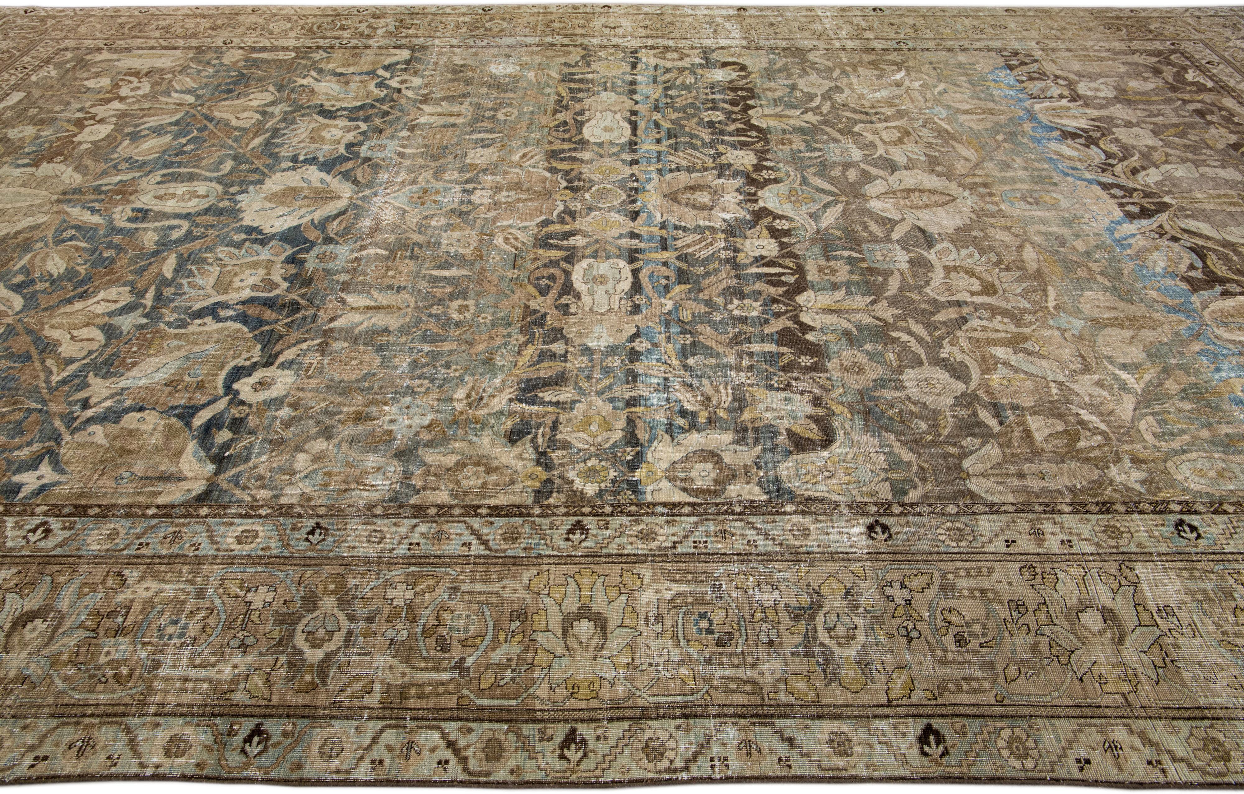 Oversize Antique Persian Heriz Handmade Floral Blue and Brown Wool Rug In Good Condition For Sale In Norwalk, CT