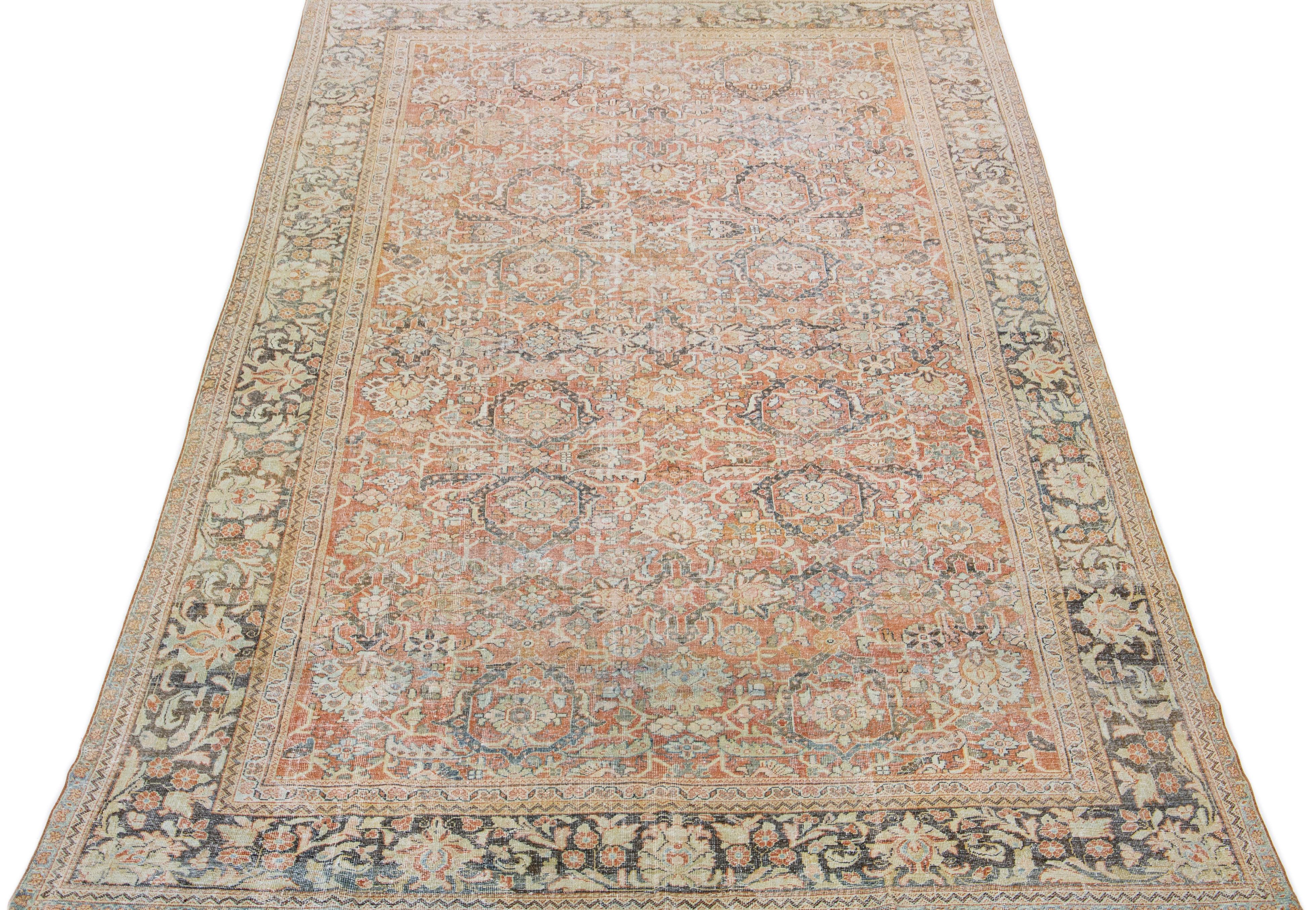 This hand-knotted mahal wool rug from the 1920s showcases a main rust field, complemented by blue, yellow, and brown hues in a traditional Allover floral motif.

This rug measures: 10' x 17'1