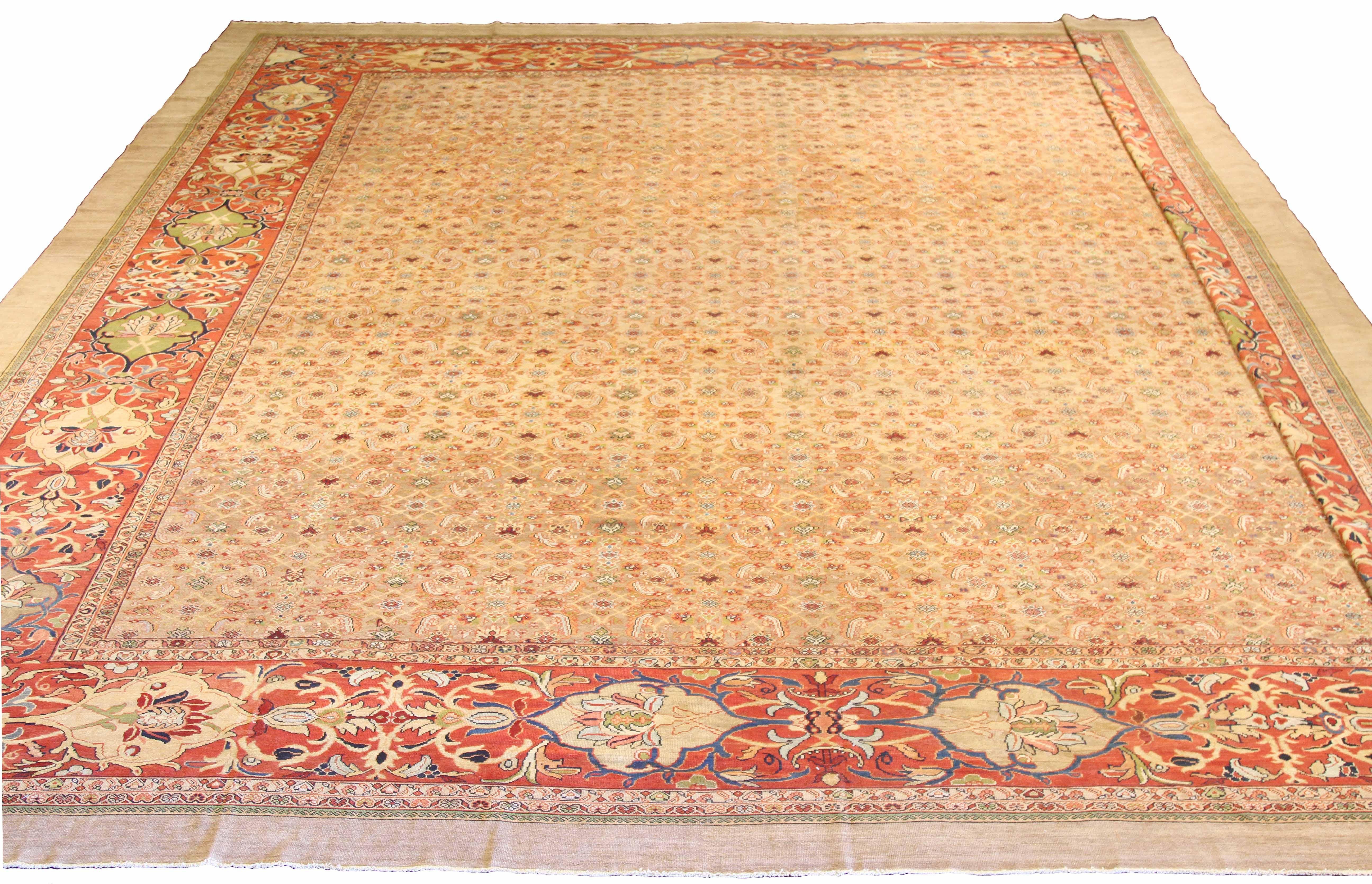 Oversized handmade Persian area rug from high-quality sheep’s wool and colored with eco-friendly vegetable dyes that are proven safe for humans and pets alike. It’s a Classic Sultanabad design showcasing a regal ivory field with prominent Herati