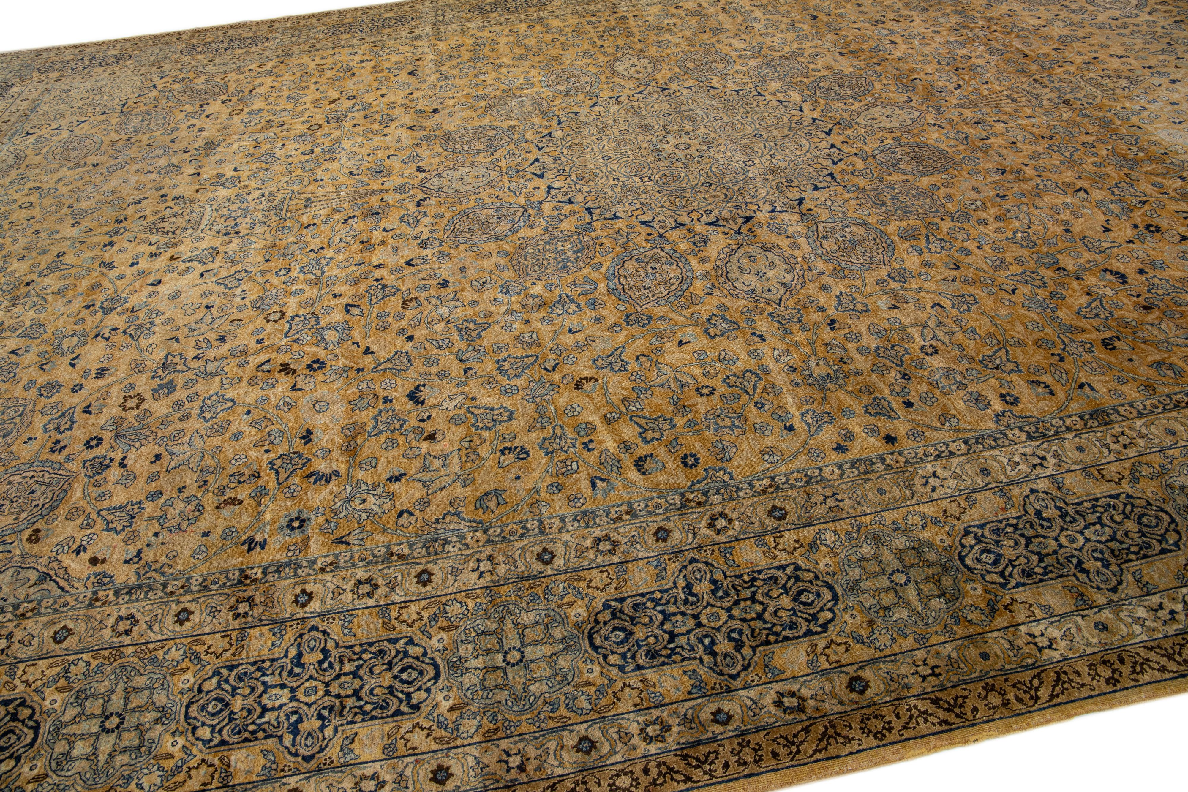 20th Century Oversize Antique Tabriz Tan Handmade Rosette Motif Persian Wool Rug For Sale