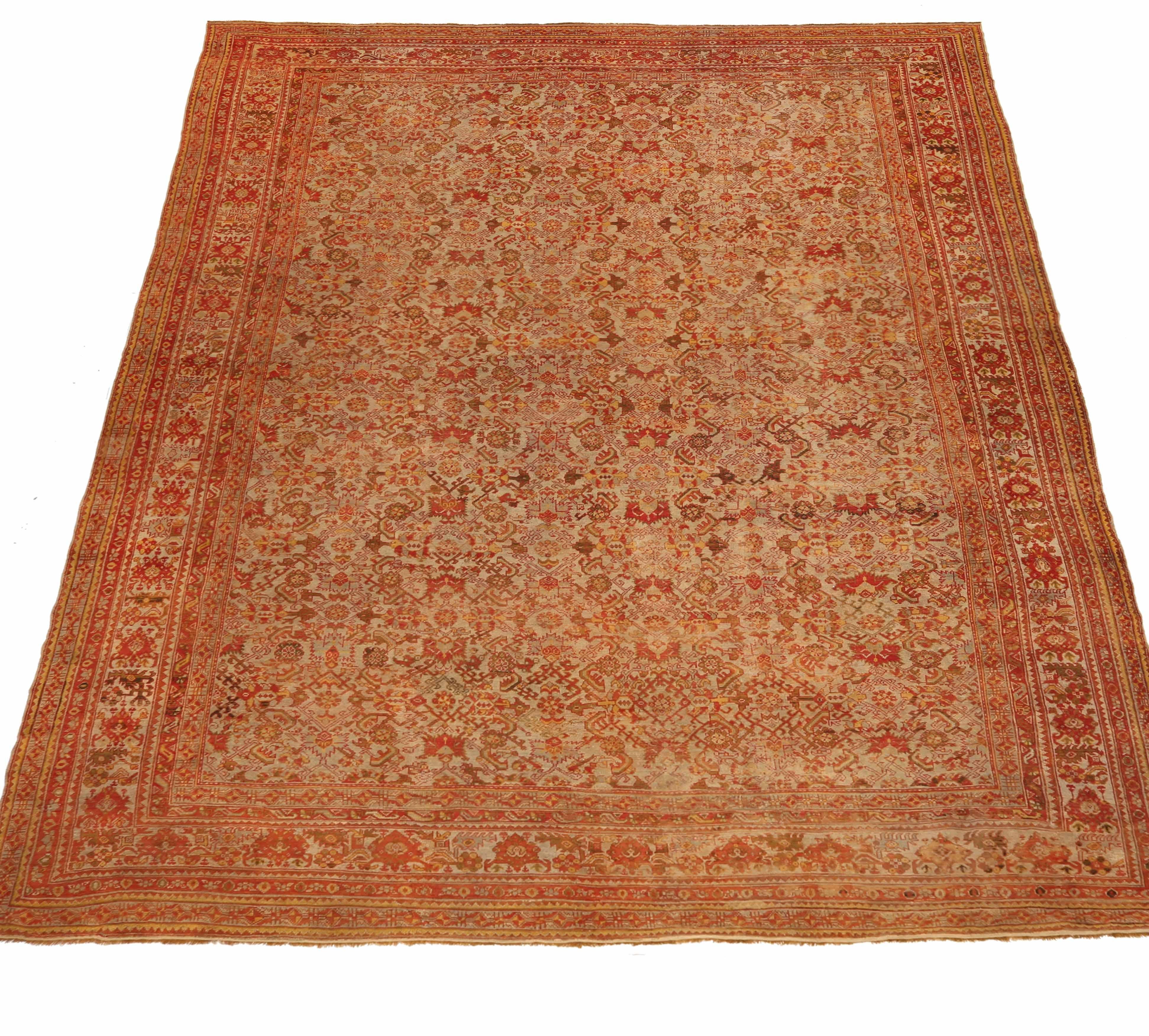 Oversize antique Turkish rug handwoven from the finest sheep’s wool. It’s colored with all-natural vegetable dyes that are safe for humans and pets. It’s a traditional Oushak design handwoven by expert artisans.It’s a lovely area rug that can be