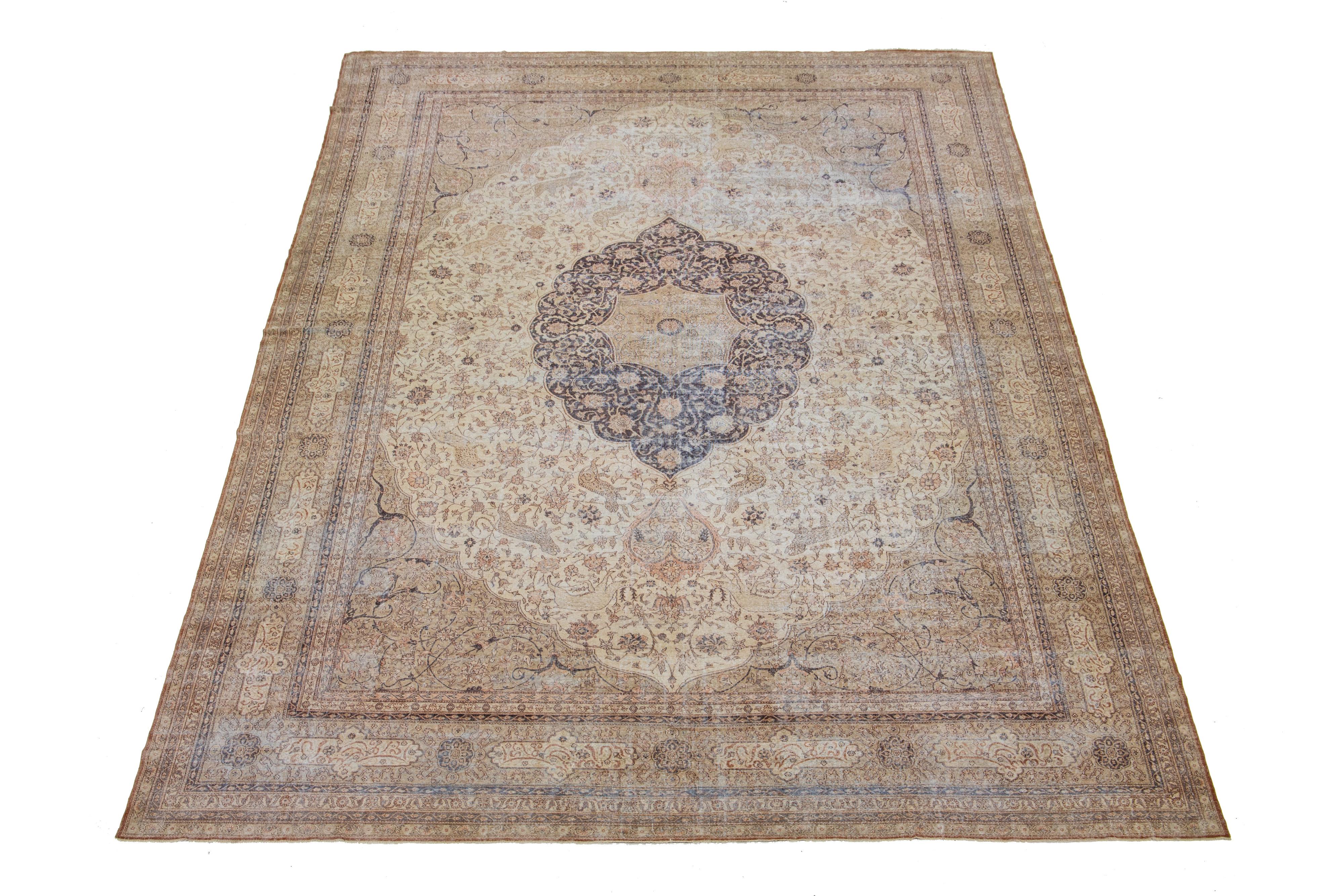 1910s Persian Sivas wool rug, handcrafted, showcases a traditional floral pattern. The contrast between the beige backdrop and the bold blue and peach emphasizes the design.

This rug measures 13'1