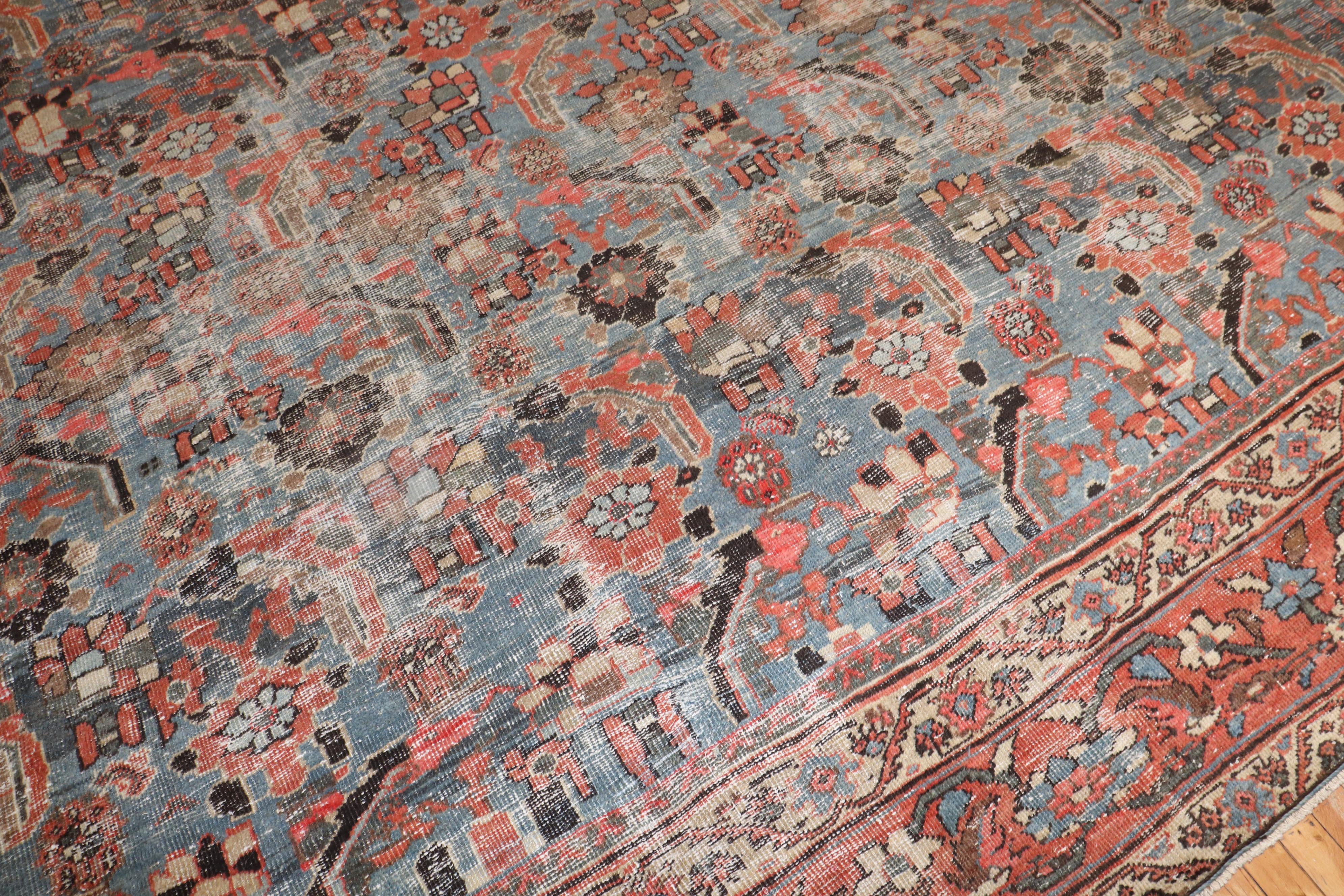 Large size early 20th century antique Persian Mahal rug with an all-over large scale geometric design on a worn blue ground.

Measures: 13'6” x 20'4