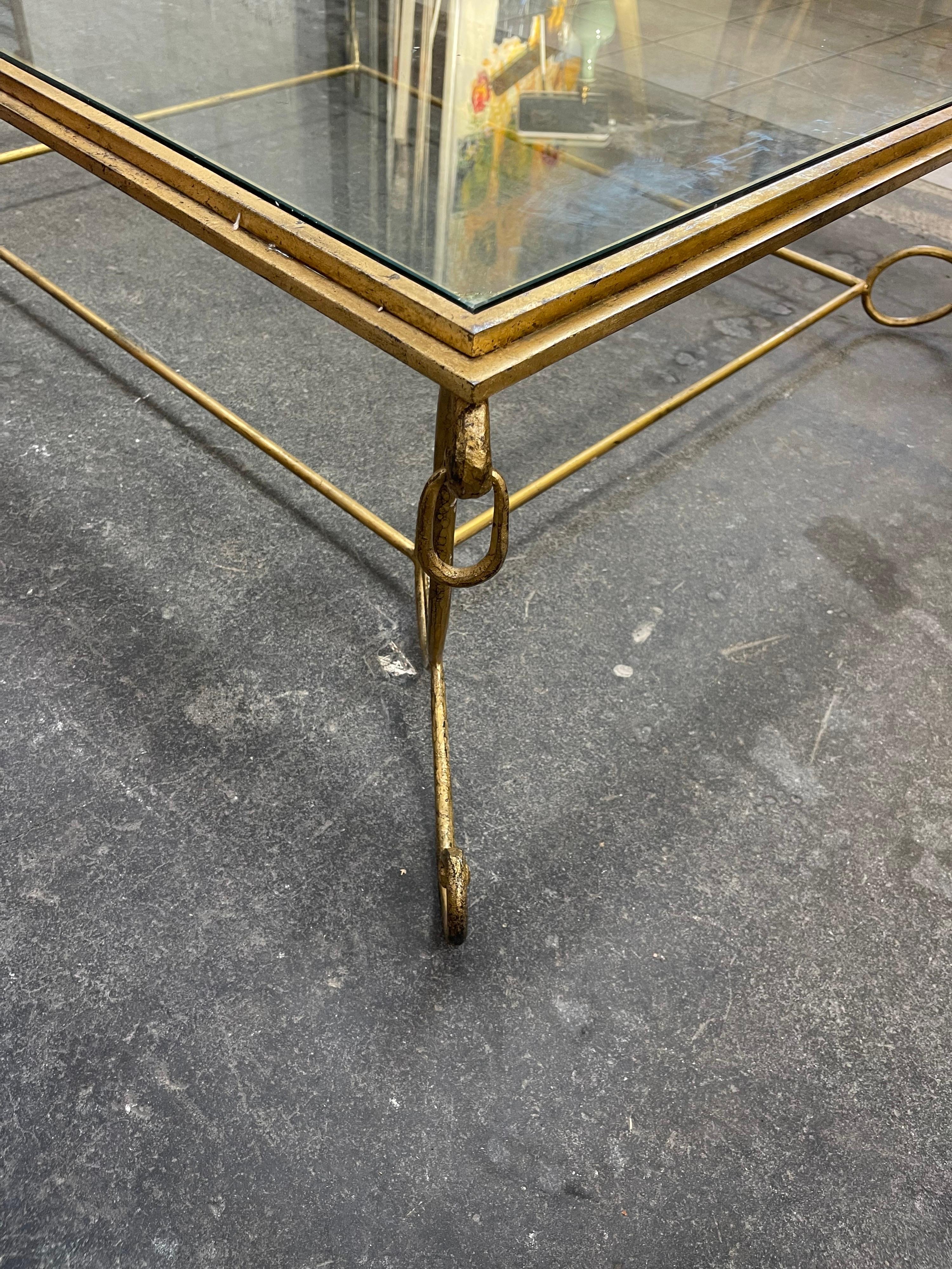 An oversize coffee table bronze and glass by 