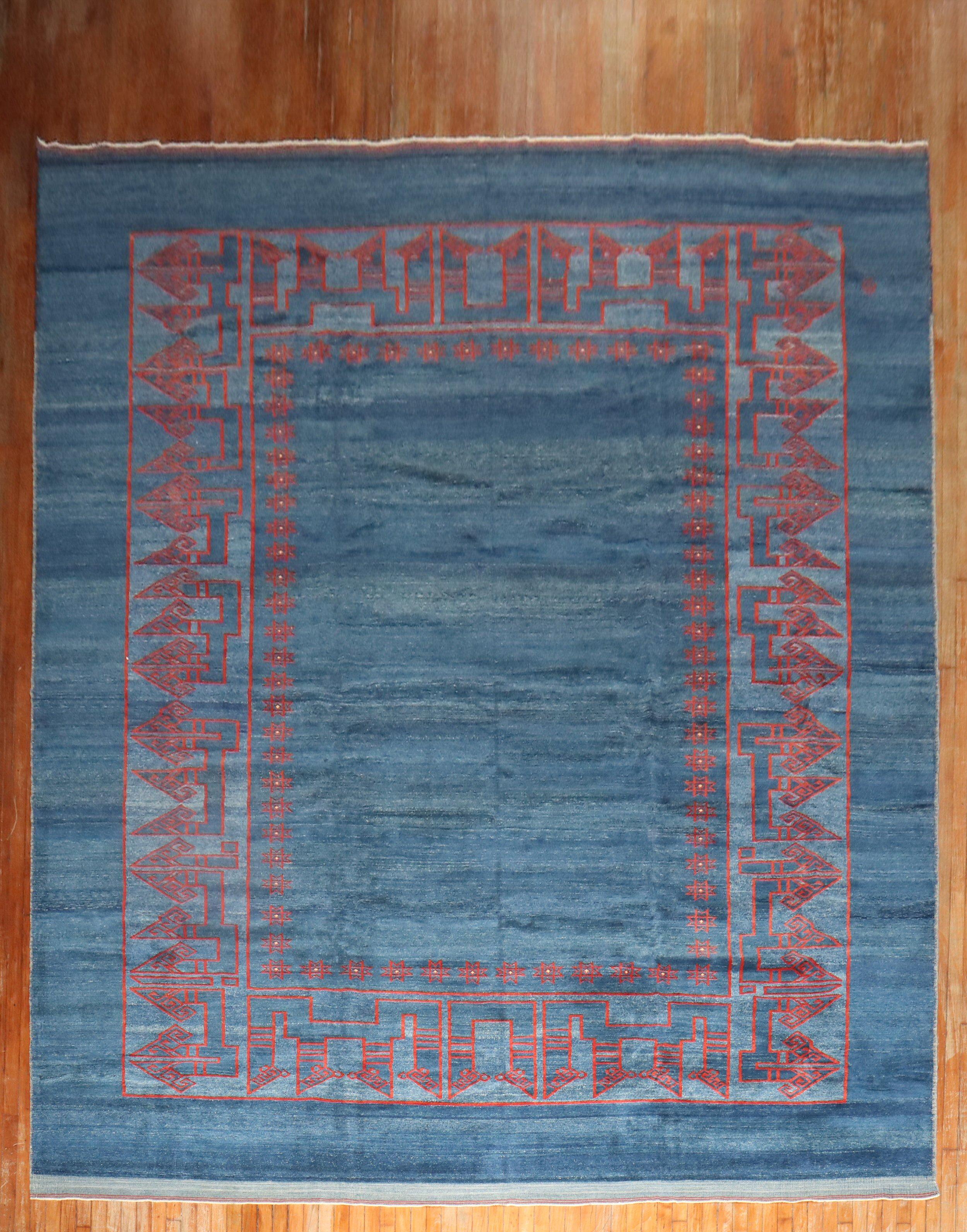 One of a kind 21st century oversize Persian rug with an open field solid design in blue and red.
100% vegetable dyed. Previously Custom ordered but never used as the rug did not work in the intended space

Measures: 11'4'' x 17'5''.
