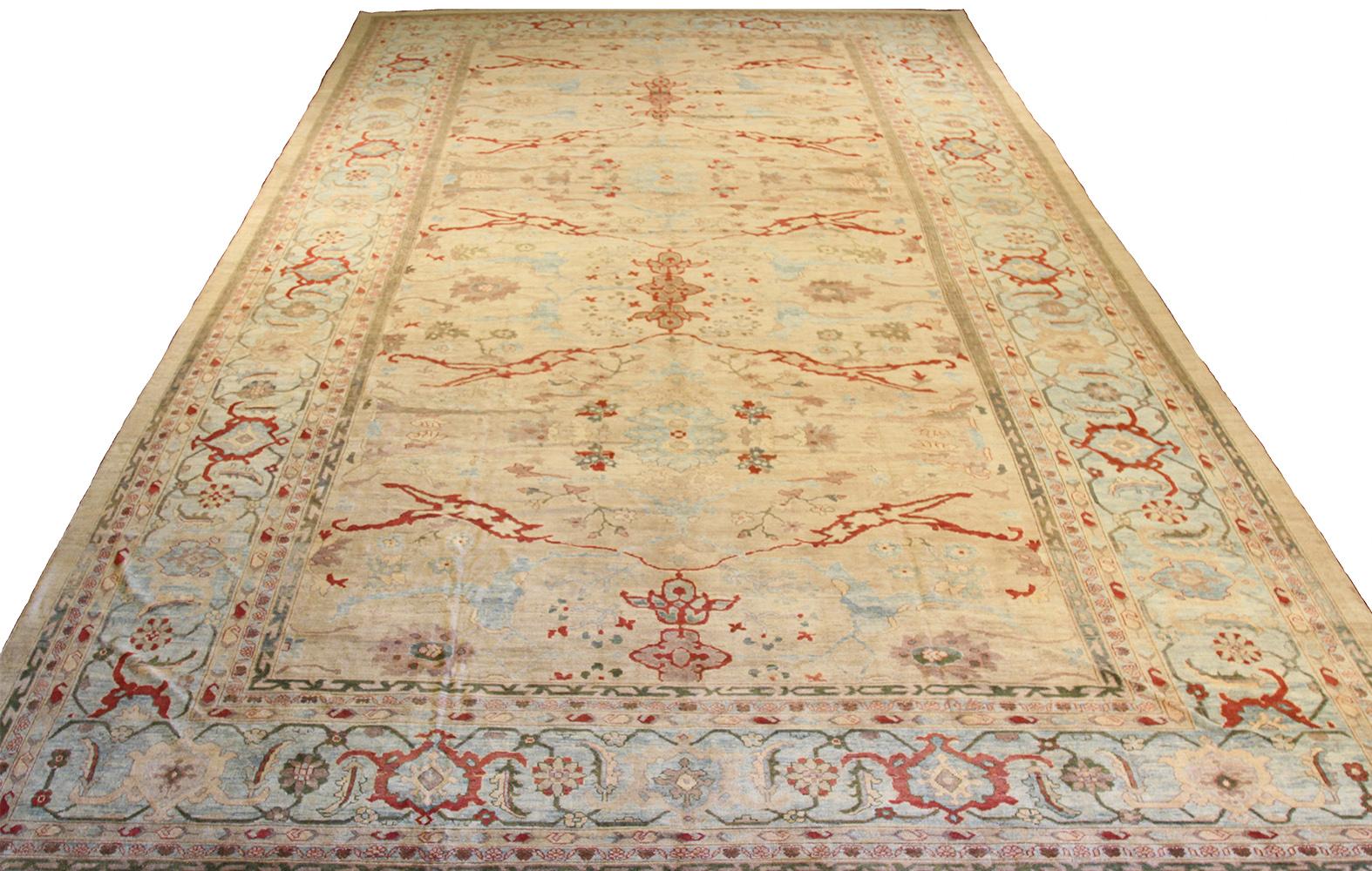 Oversize handmade Turkish area rug from high-quality sheep’s wool and colored with eco-friendly vegetable dyes that are proven safe for humans and pets alike. It’s a Classic Sultanabad design showcasing a regal ivory field with prominent Herati