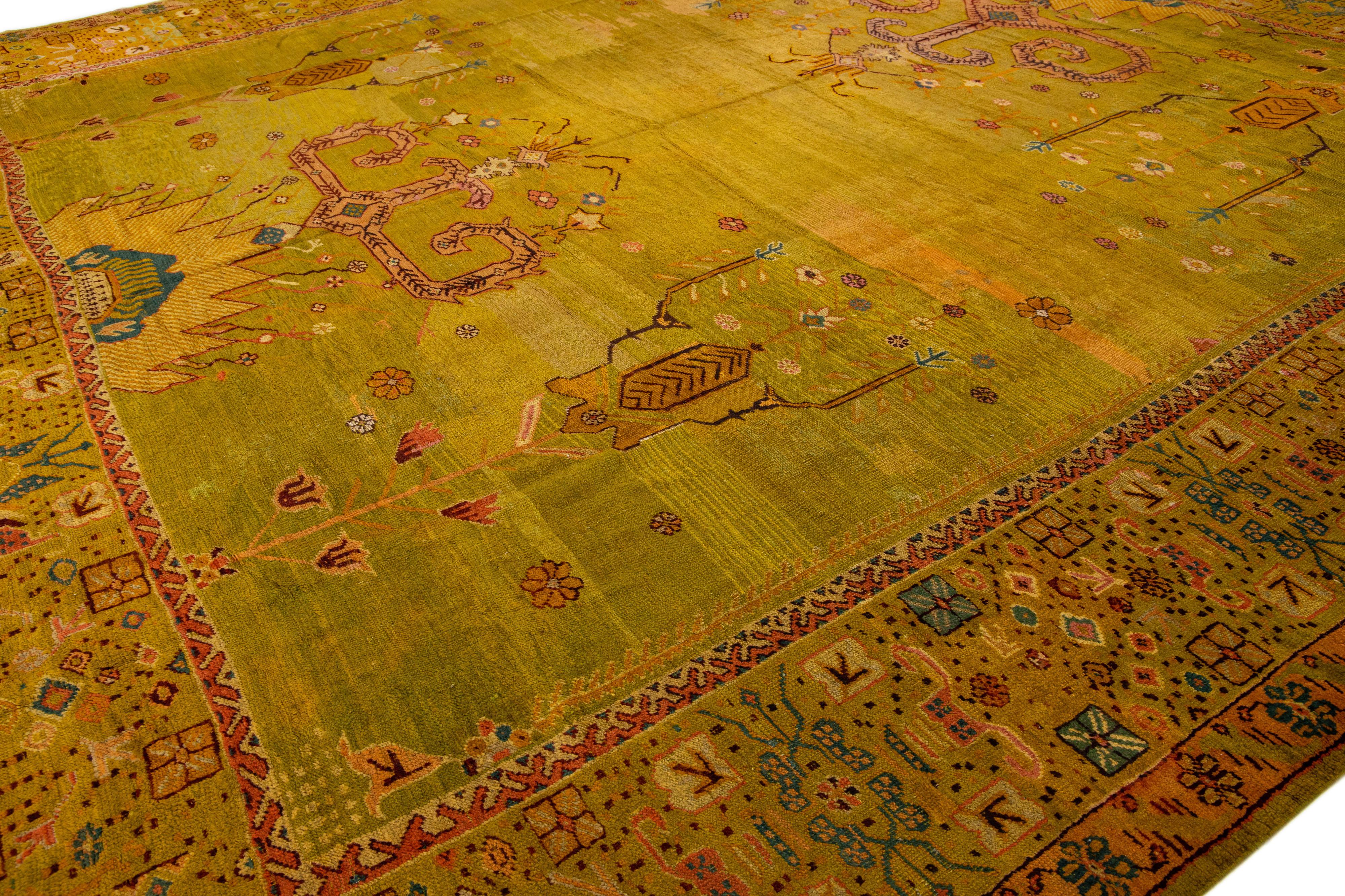 Hand-Knotted Oversize Designed 19th Century Turkish Oushak Wool Rug with Olive Yellow Field For Sale