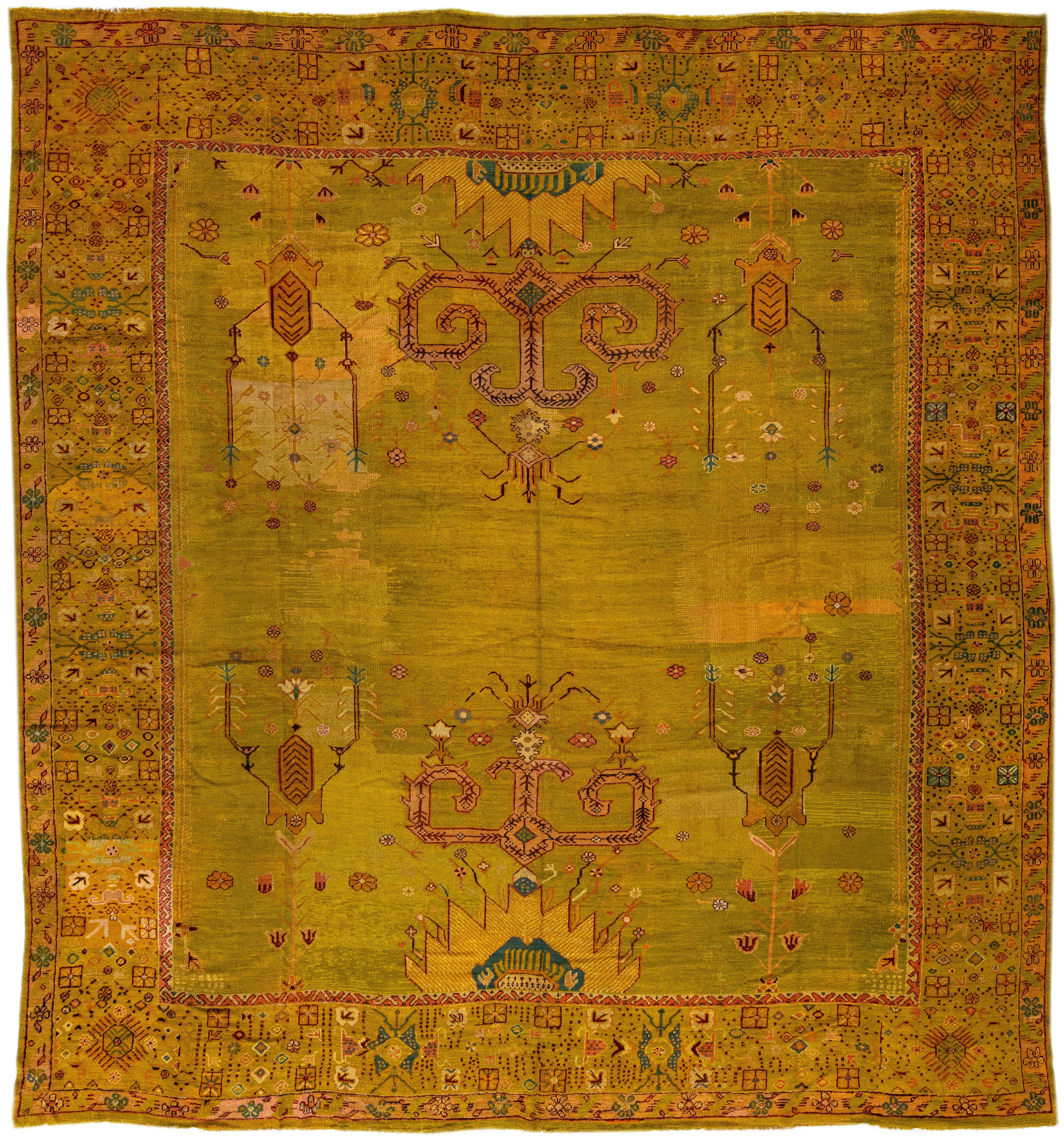 Oversize Designed 19th Century Turkish Oushak Wool Rug with Olive Yellow Field For Sale