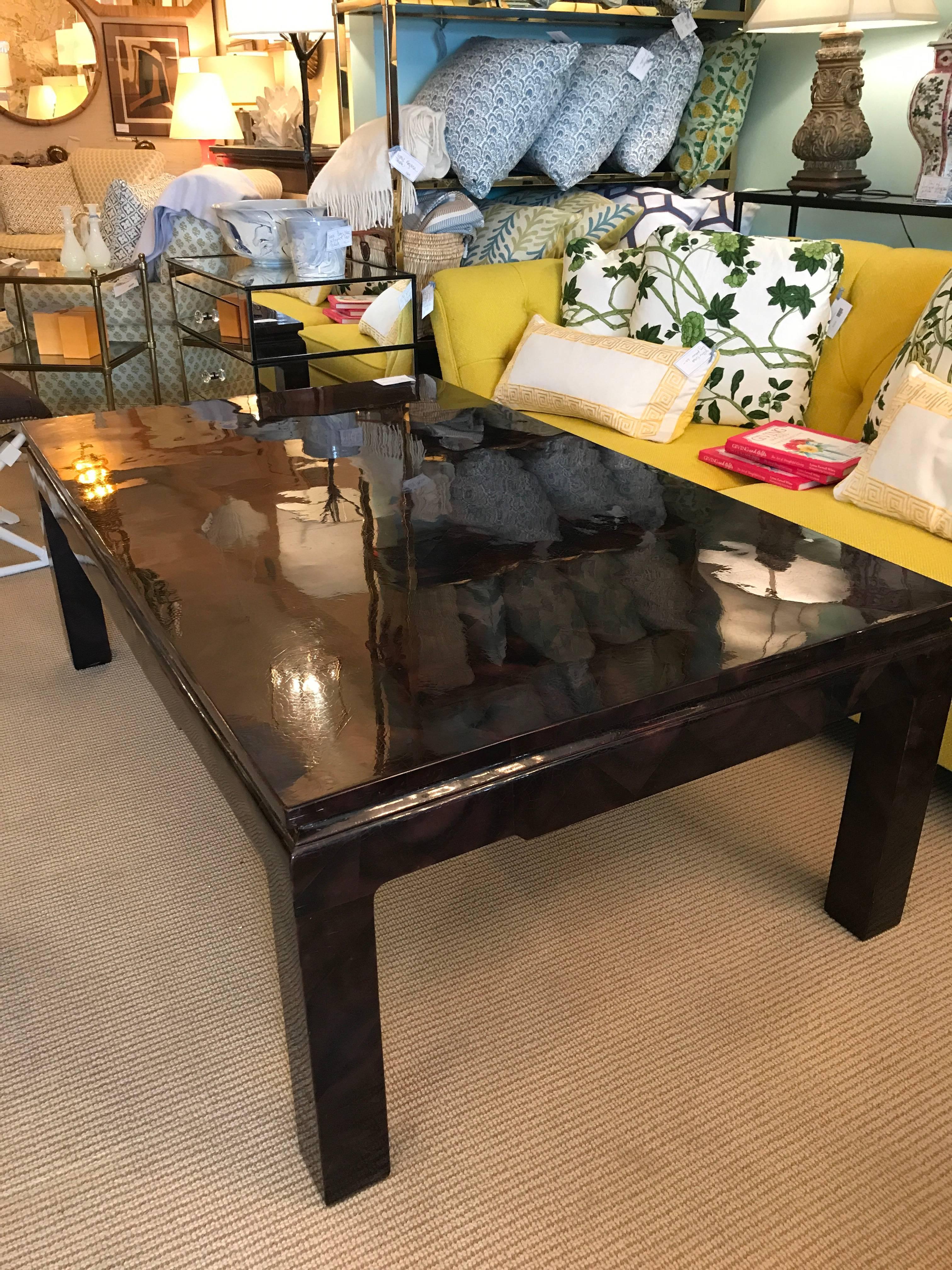 Oversize faux tortoise/pen shell coffee table. The surface and legs are entirely faced in faceted shards of triangular pen shell.