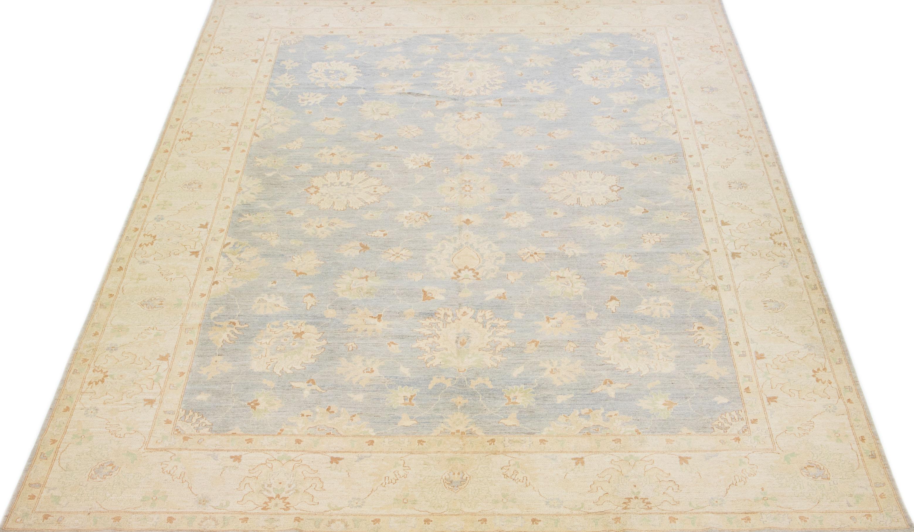 This Oversize Oushak Style wool rug showcases exceptional craftsmanship with meticulous attention to detail. Embellished with beautiful beige, brown, and green accents, the rug features an alluring floral pattern to enhance décor. It boasts a