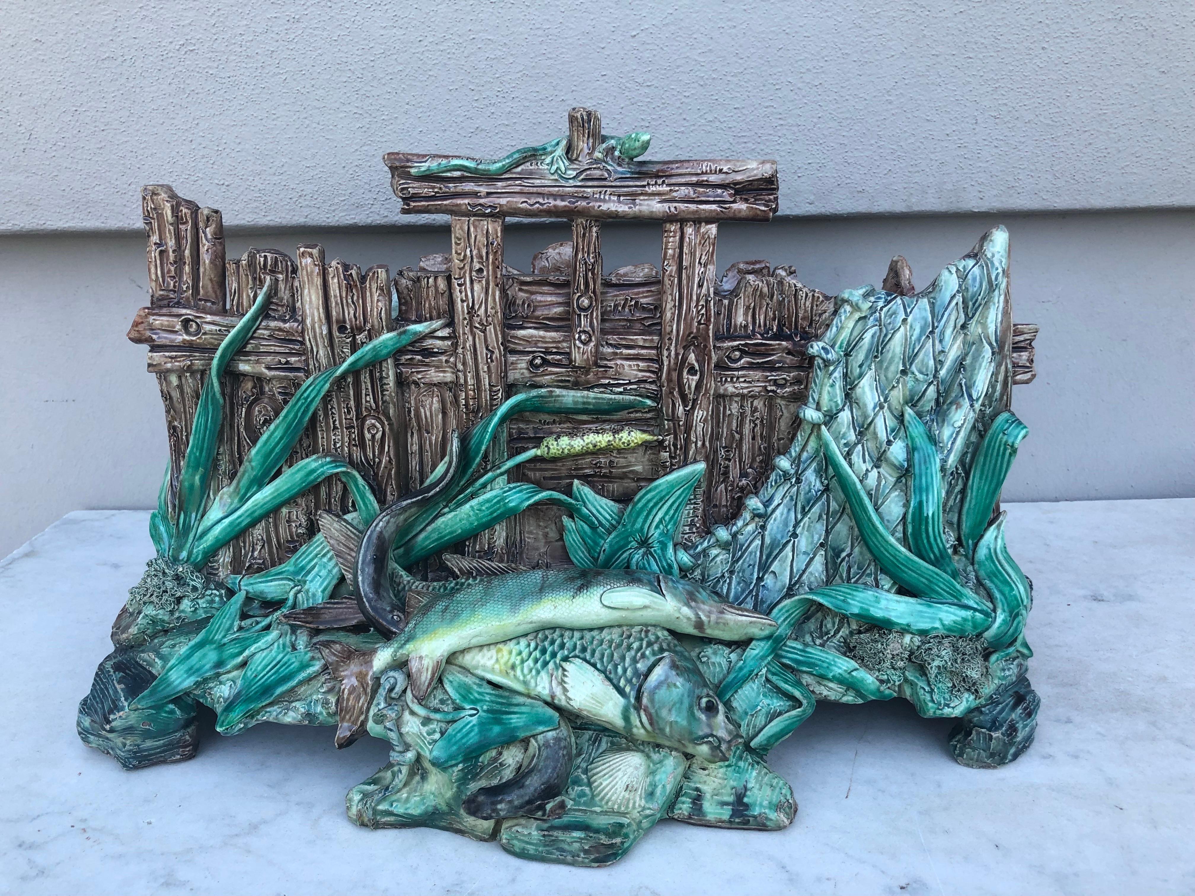 Oversize French Majolica Palissy fishes jardiniere Circa 1880.
Attributed to Thomas Sergent.
Very rare model, trompe l'oeil wood crate with fishing nets, fish, aquatics plants and lizard.
18 inches length, 11 inches depth, 12 inches height.