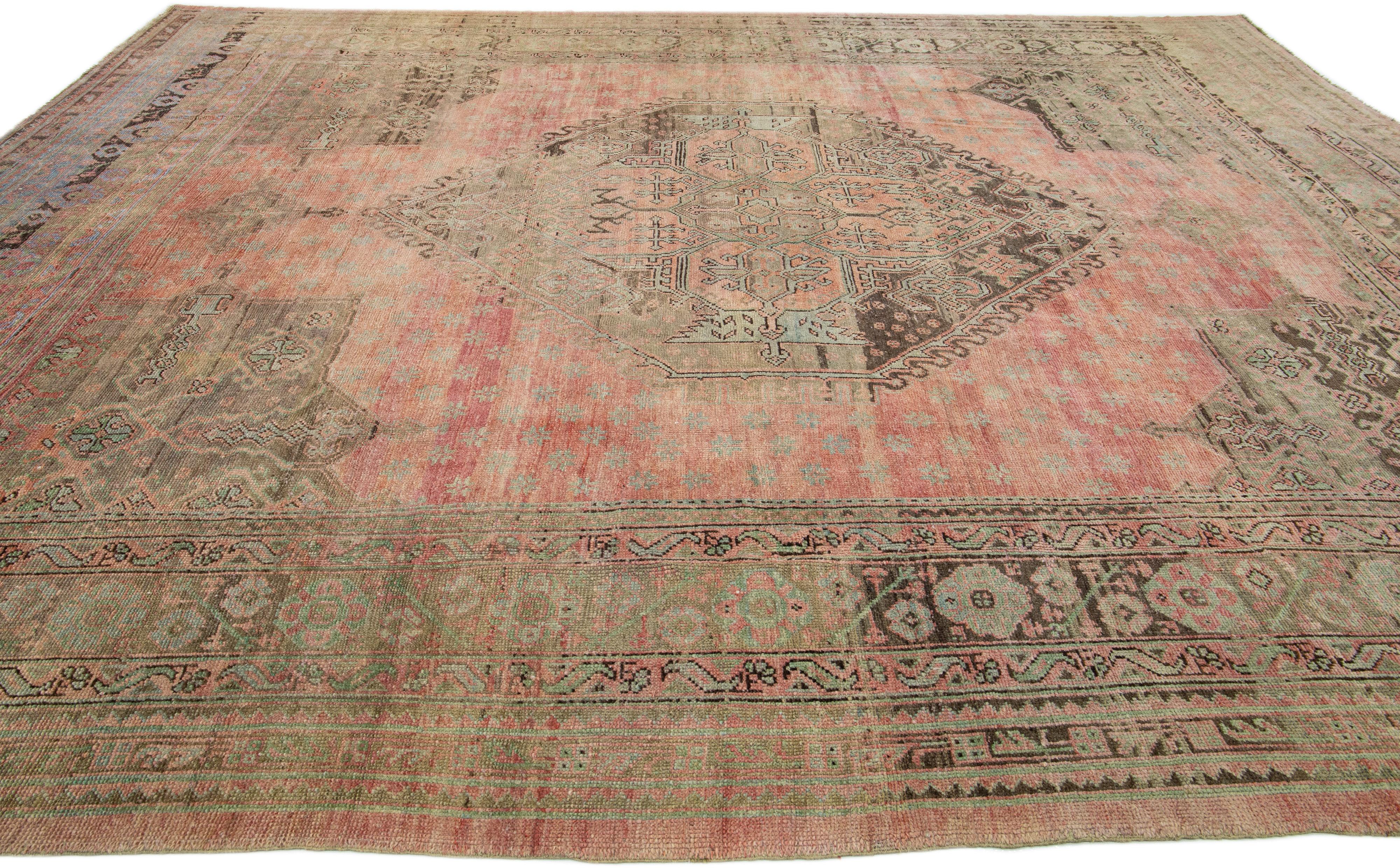 20th Century Oversize Handmade Antique Turkish Oushak Wool Rug in Rose Color For Sale