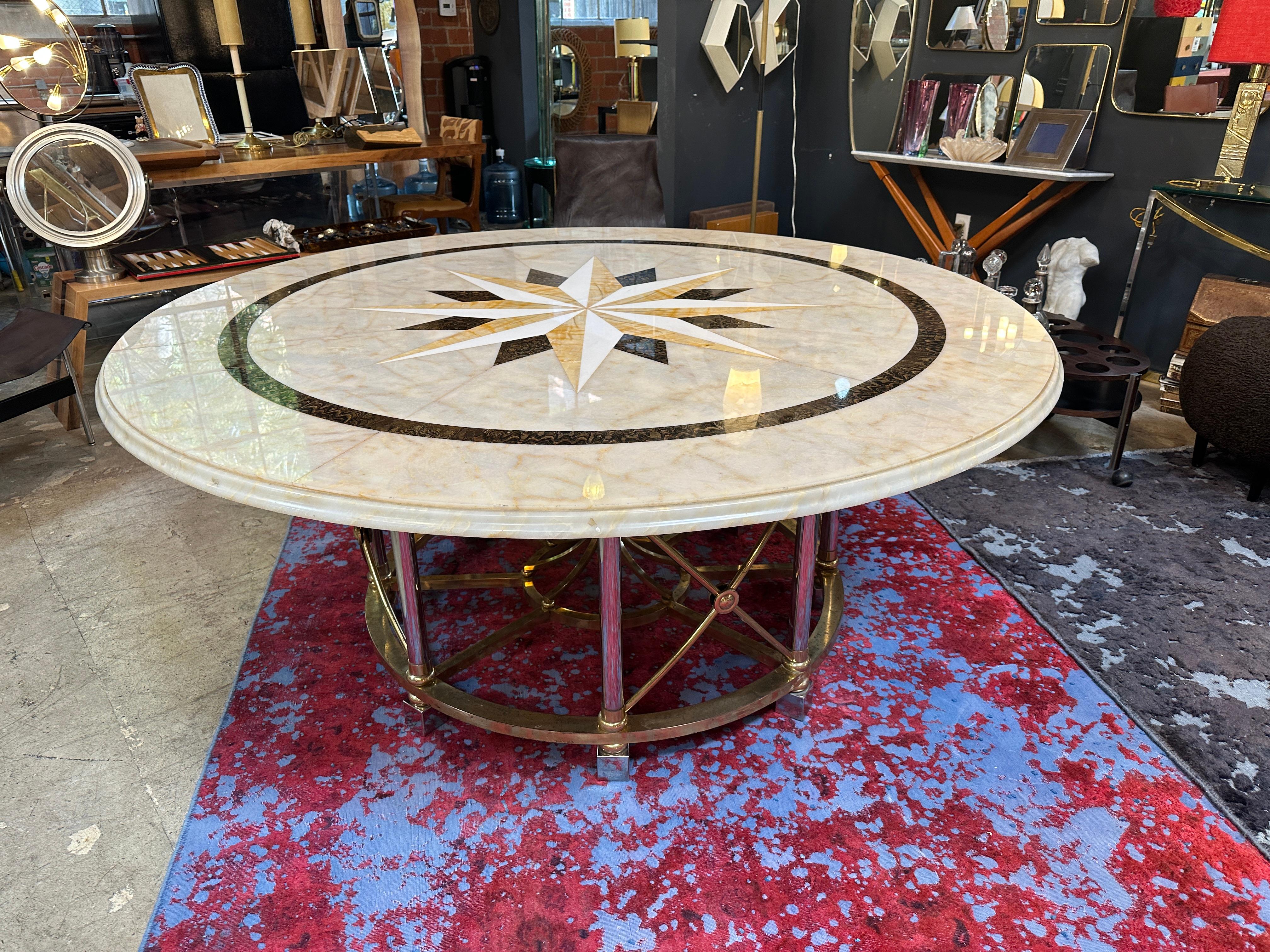 This oversize round marble table is a beautiful example of Italian design from the 1960s. It features a large, 1960s-era style round marble tabletop, which provides ample space for dining or gathering. The use of marble adds a luxurious and elegant