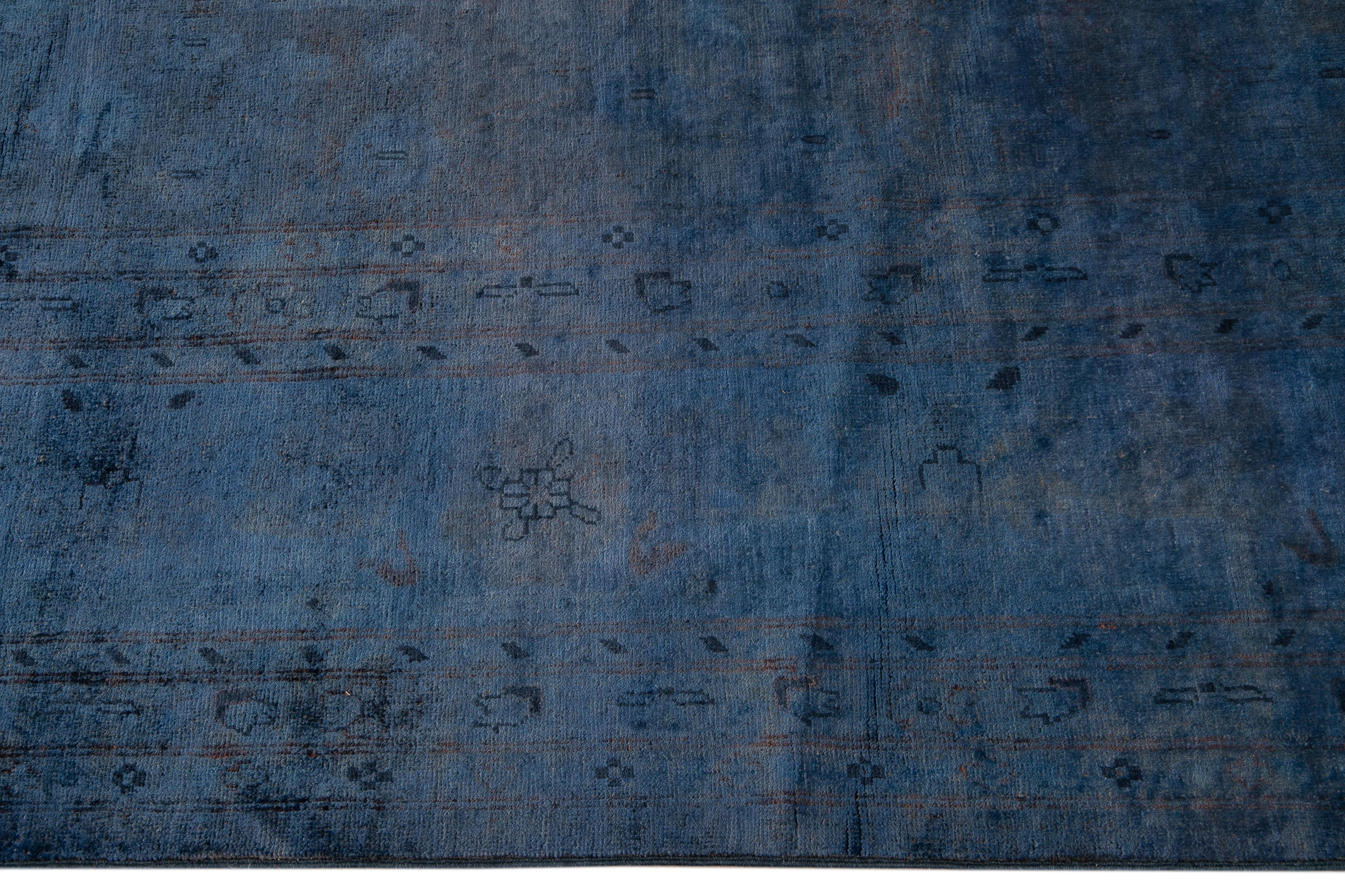 Pakistani Oversize Modern Blue Overdyed Wool Rug Handmade with Floral Motif For Sale