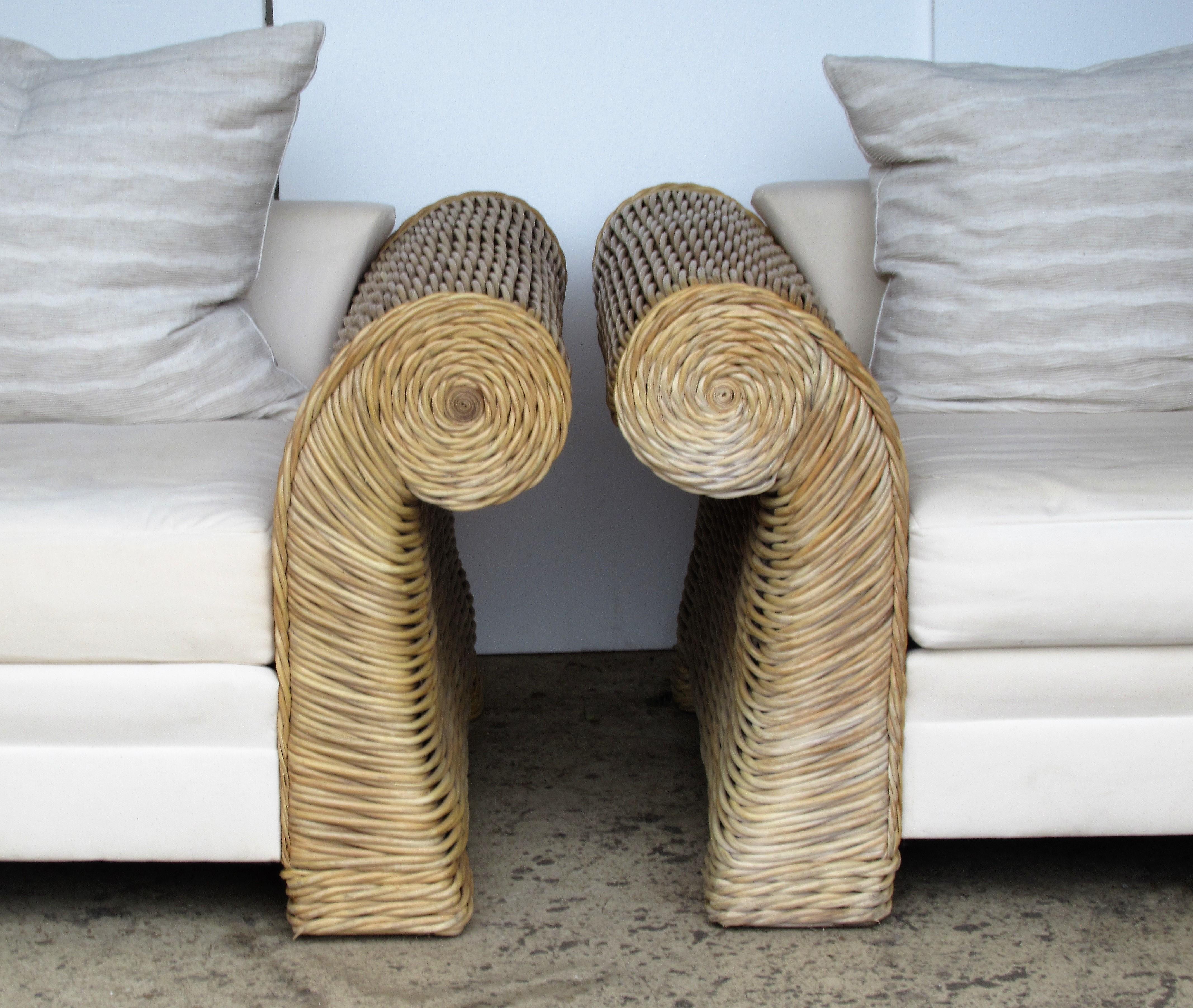 A pair of very large-scale natural woven rattan roll arm lounge chairs by O-Asian Designs, Inc., circa 1980. Exceptional quality heavy weight solid construction. Great looking pair of chairs with beautifully aged pale surface color and bold form.
