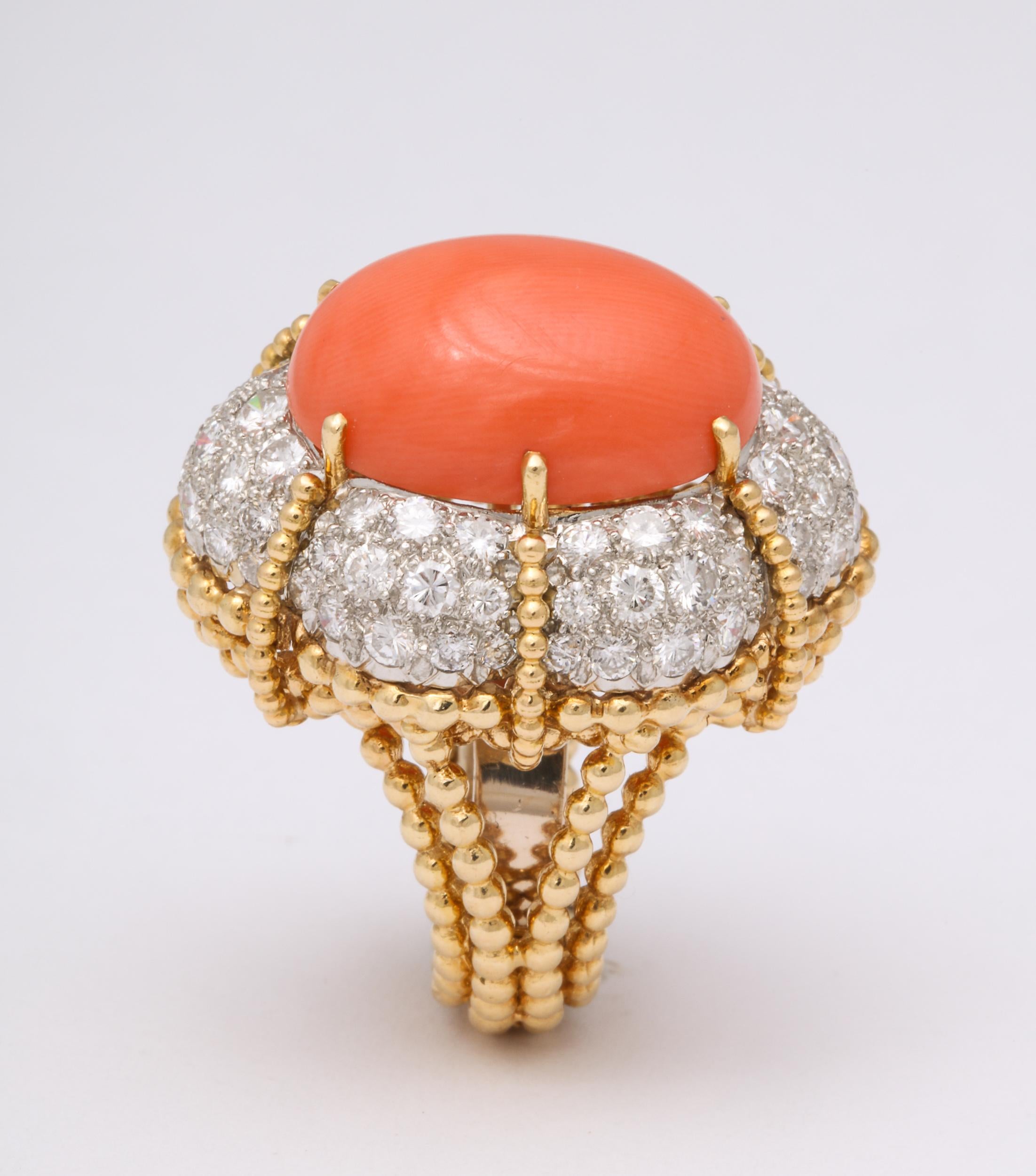  Cabochon Orange Coral and Diamond Ring measuring 20mm x 15mm and  set in a handmade  18kt Karat Yellow Gold beaded rope Mounting.  The 98 Diamonds measure approximately 5 carats total.  Very elegant and regal.  Size is approximately 5.75 but can be