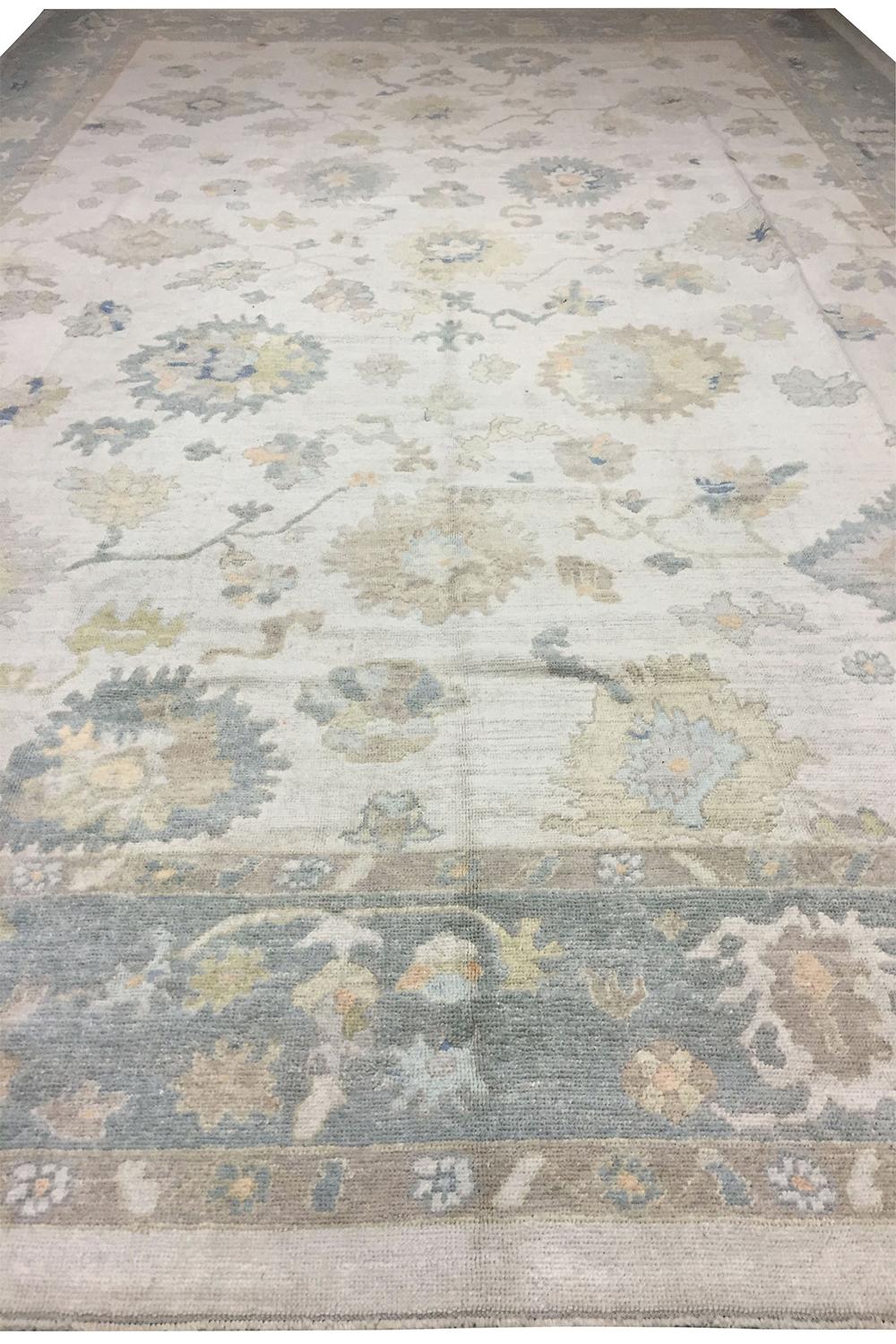 Oversize Oushak style handwoven carpet rug, 14'4 x 20'8. Handwoven in Turkey using the finest of materials this is a Classic recreation of an Oushak rug in soft colors.