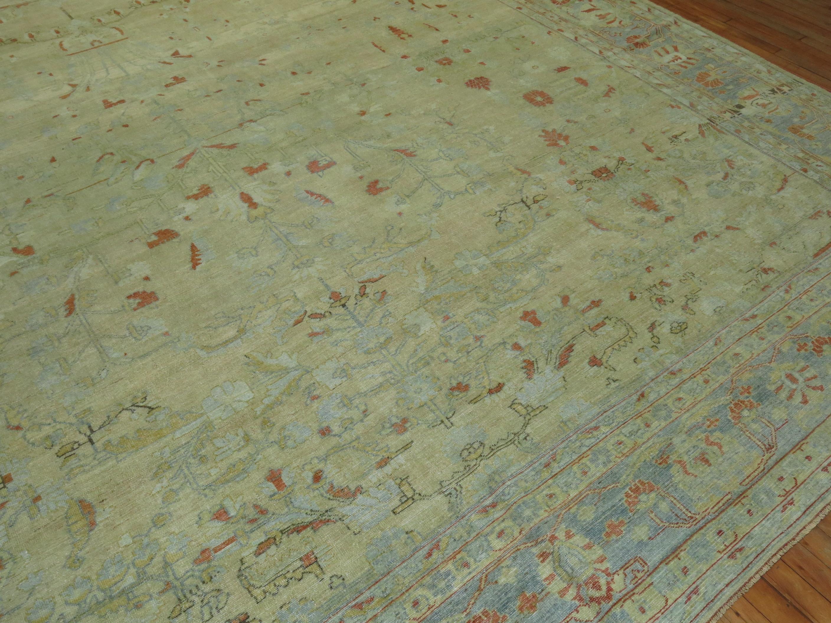 Stunning oversize antique Persian Mohajeran Sarouk rug consisting of a pale wheat ground and powder blue border, some terracotta accents too, circa 1910. 

Measures: 13' x 19'8