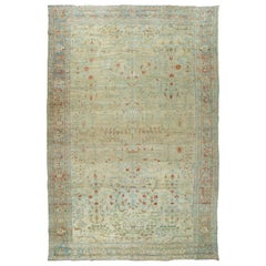 Tapis antique persan pâle surdimensionné