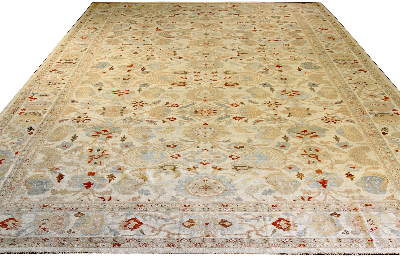 Oversize handmade Persian area rug from high-quality sheep’s wool and colored with eco-friendly vegetable dyes that are proven safe for humans and pets alike. It’s a Classic Sultanabad design showcasing a regal ivory field with prominent Herati