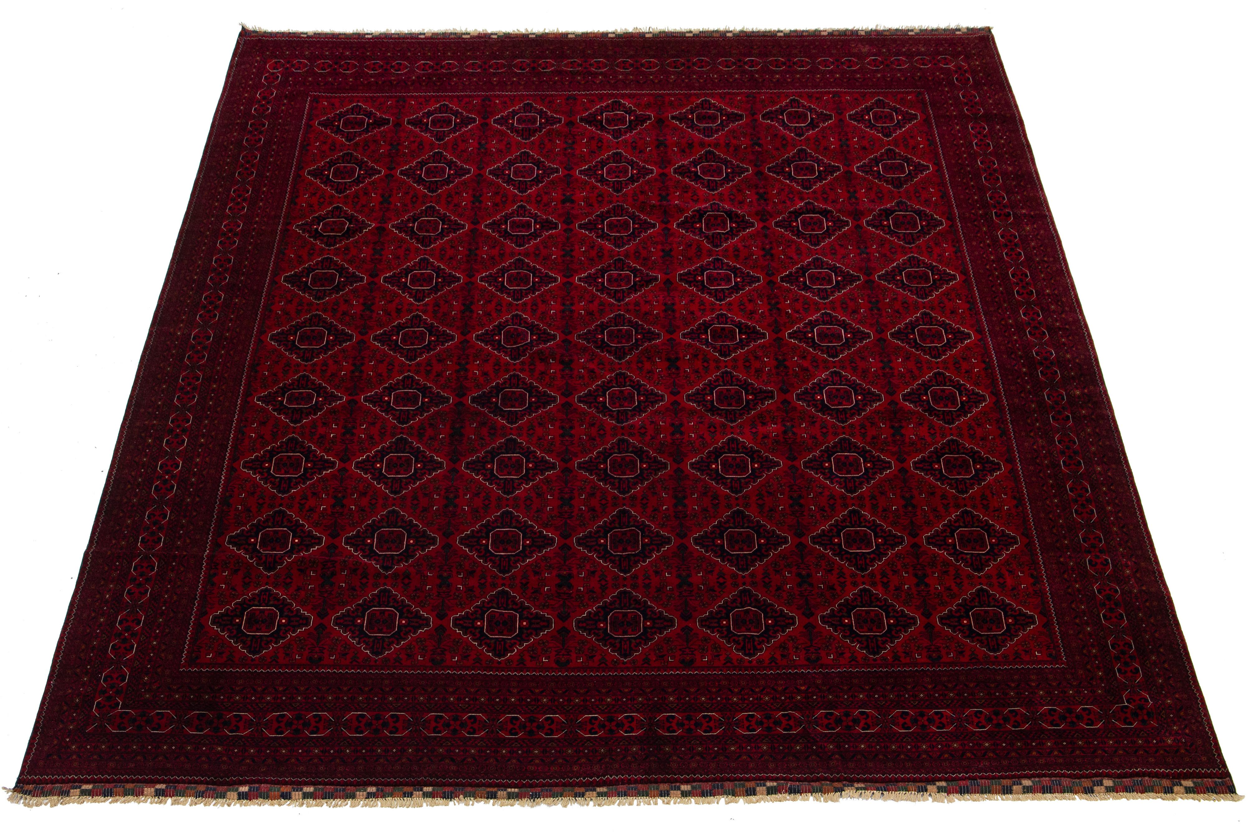 Beautiful vintage Bokhara hand-knotted wool rug with a red field. This Persian rug has navy blue accents in a gorgeous all-over geometric Pattern Design.

This rug measures 13' x 15'10