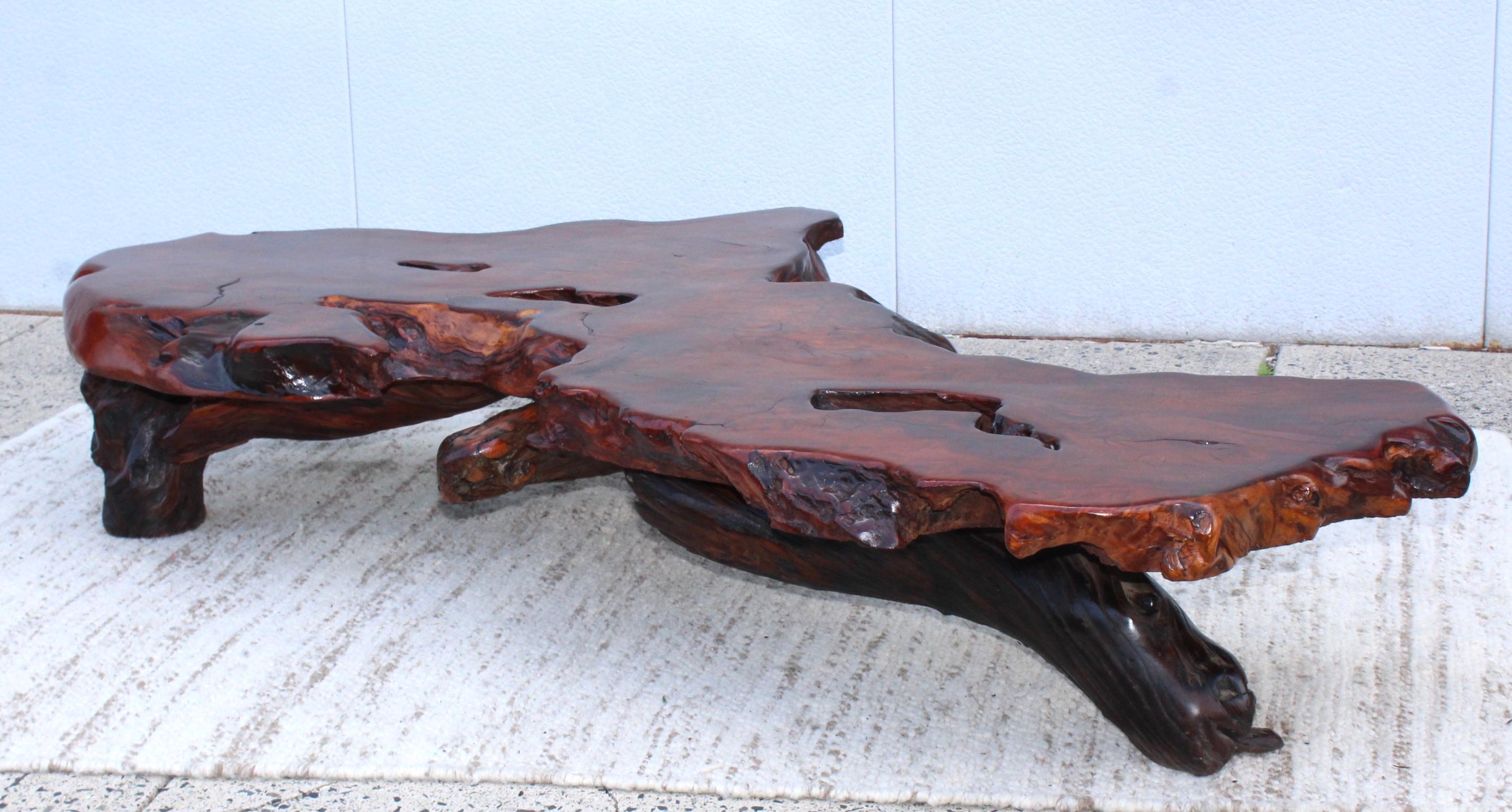 Stunning massive redwood with three-tree root legs, I purchased this table from the original owner who purchased it in California in 1969, in vintage original condition with minor wear and patina.