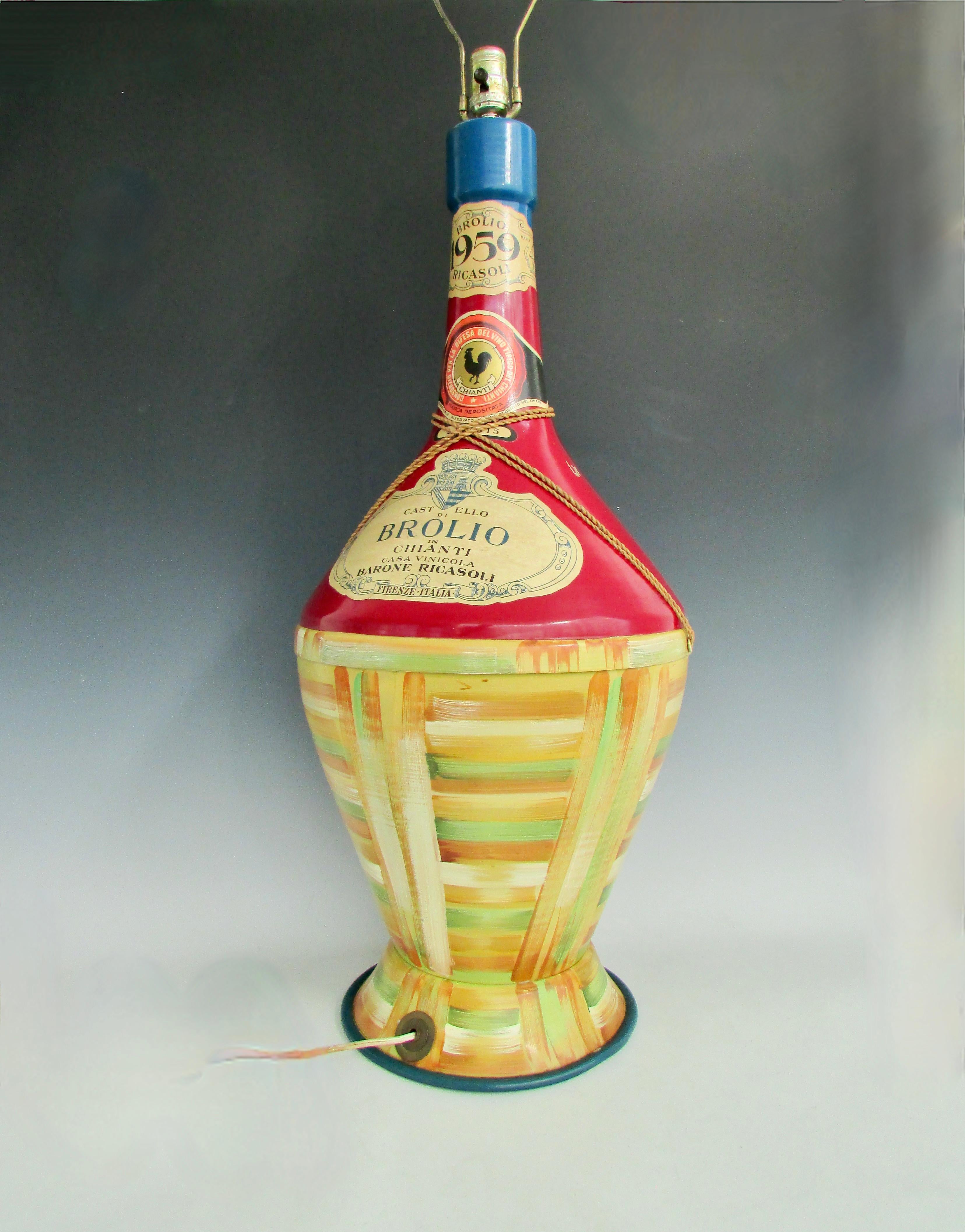 Large pressed steel wine chianti bottle table lamp. Hand painted design with printed paper labels. Not sure if this was a store promotional or folk / studio made. Interesting and nice decor for restaurant or home wine cave. Lamp body measures 32