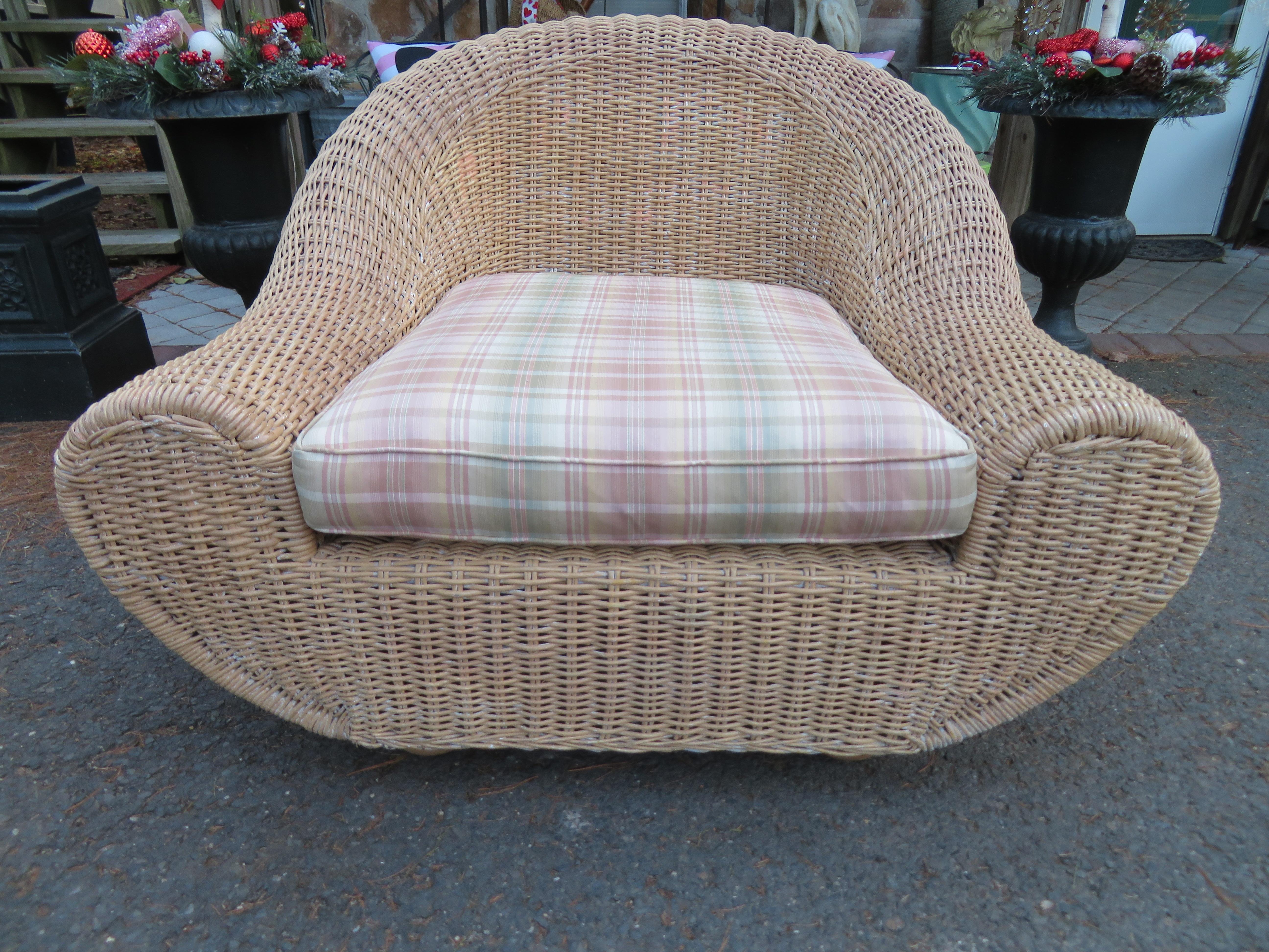 Oversized sculptural wicker chair in the manner of Michael Taylor or Eero Aarnio. We love the large scale and unusual shape of the wonderful vintage wicker chair. It measures 34