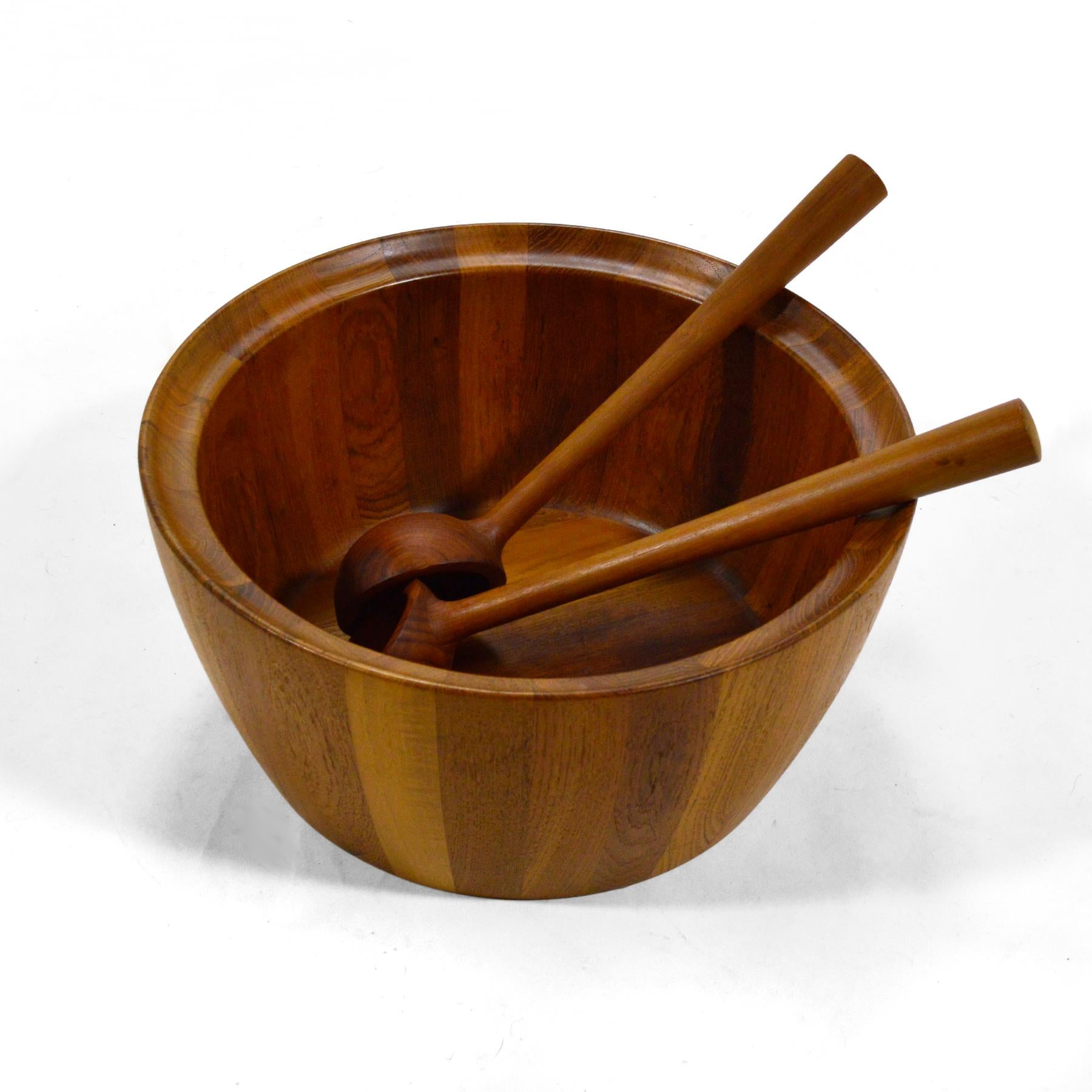 This spectacular staved teak bowl by Richard Nissen is not only noteworthy for its design and quality of craftsmanship, but also for it's terrific large scale. It comes complete with a beautiful pair of servers. All three pieces are in fantastic