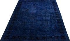 Tapis surdimensionné transitionnel en laine fait à la main en bleu
