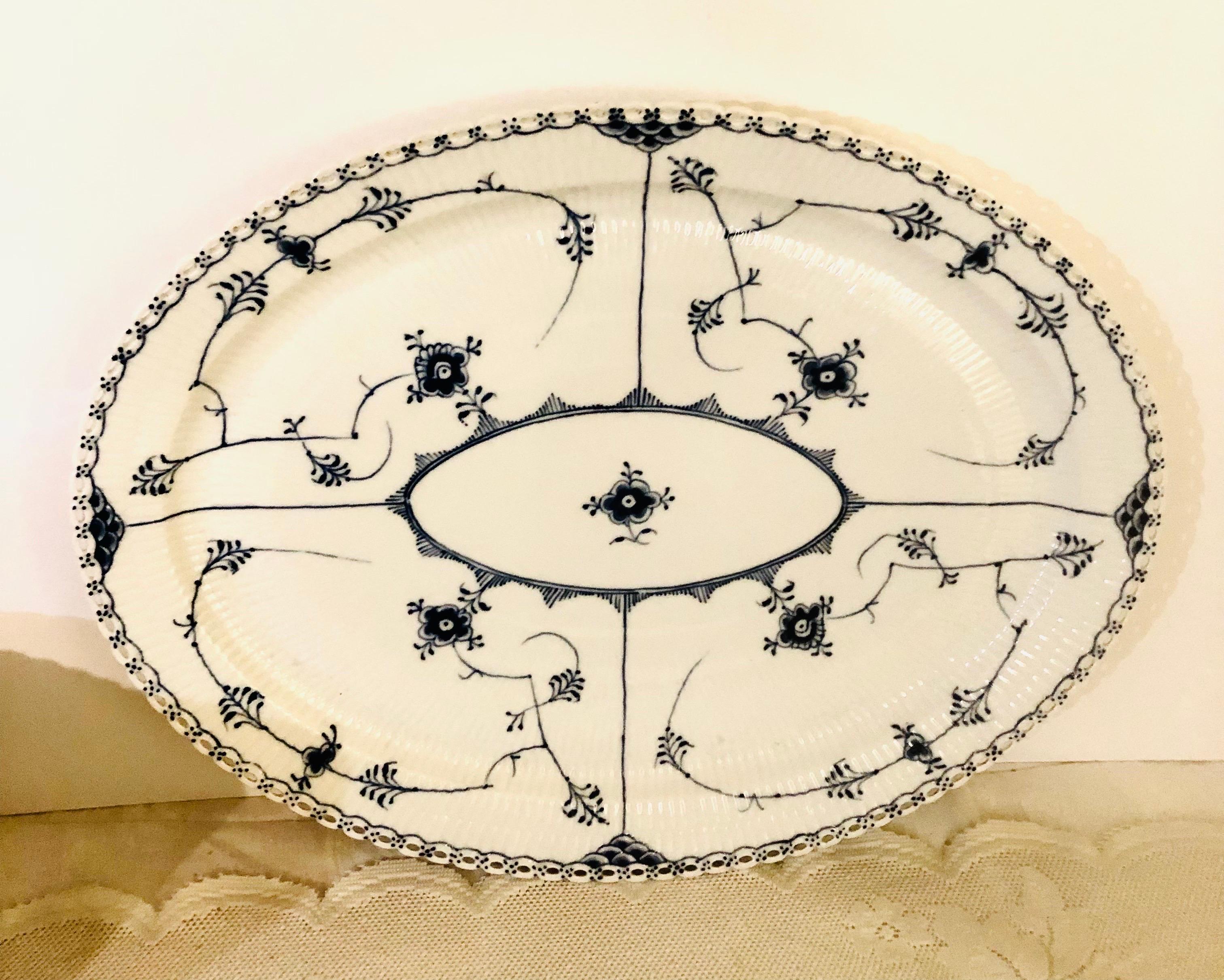 I want to offer you this fabulous oversized Royal Copenhagen platter with full lace openwork design on the borders. This full lace fluted dinnerware was the first dinner service sold by Royal Copenhagen in 1775. In 1885, the artistic director of