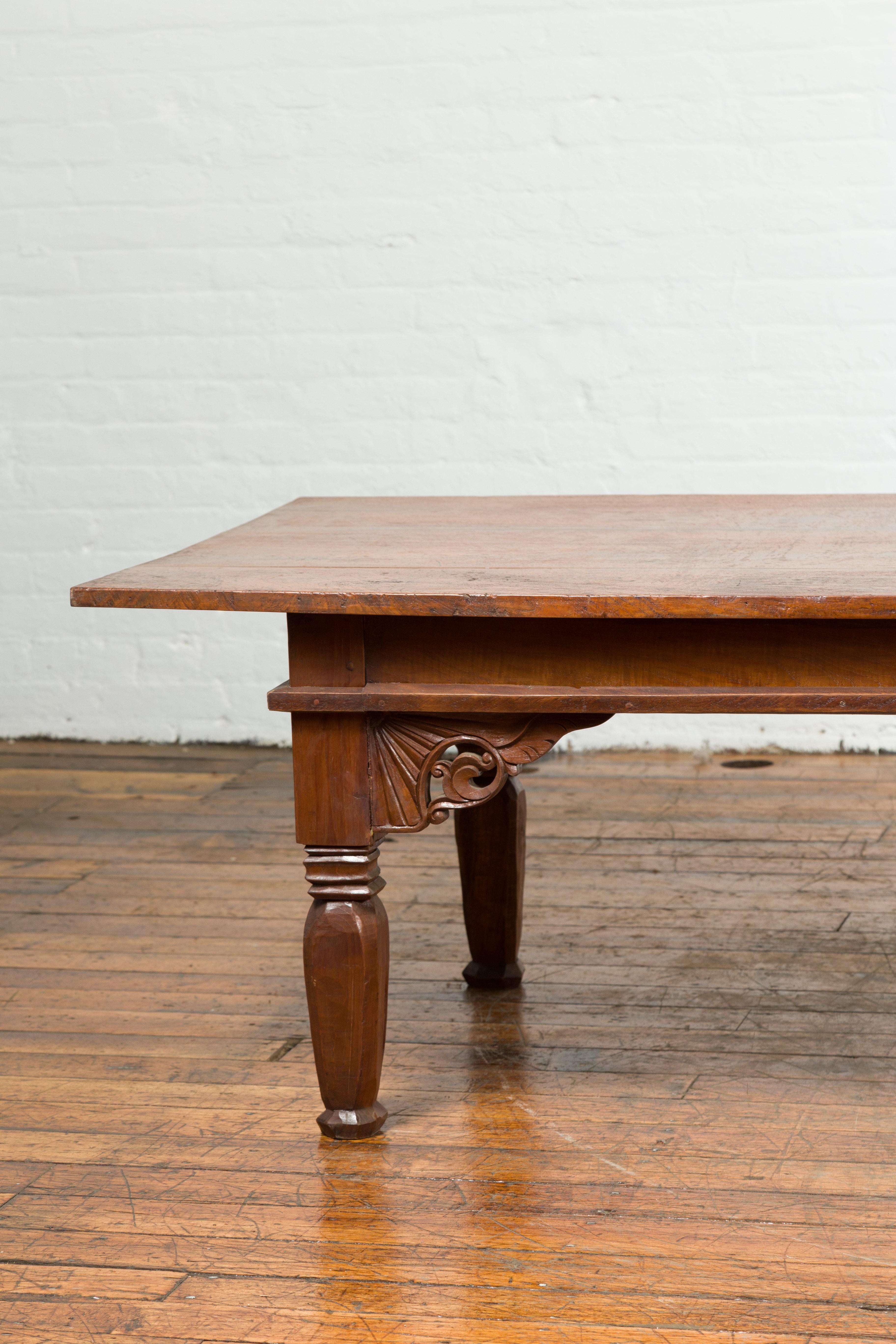 Oversized 19th Century Indonesian Madurese Coffee Table with Carved Spandrels In Good Condition For Sale In Yonkers, NY