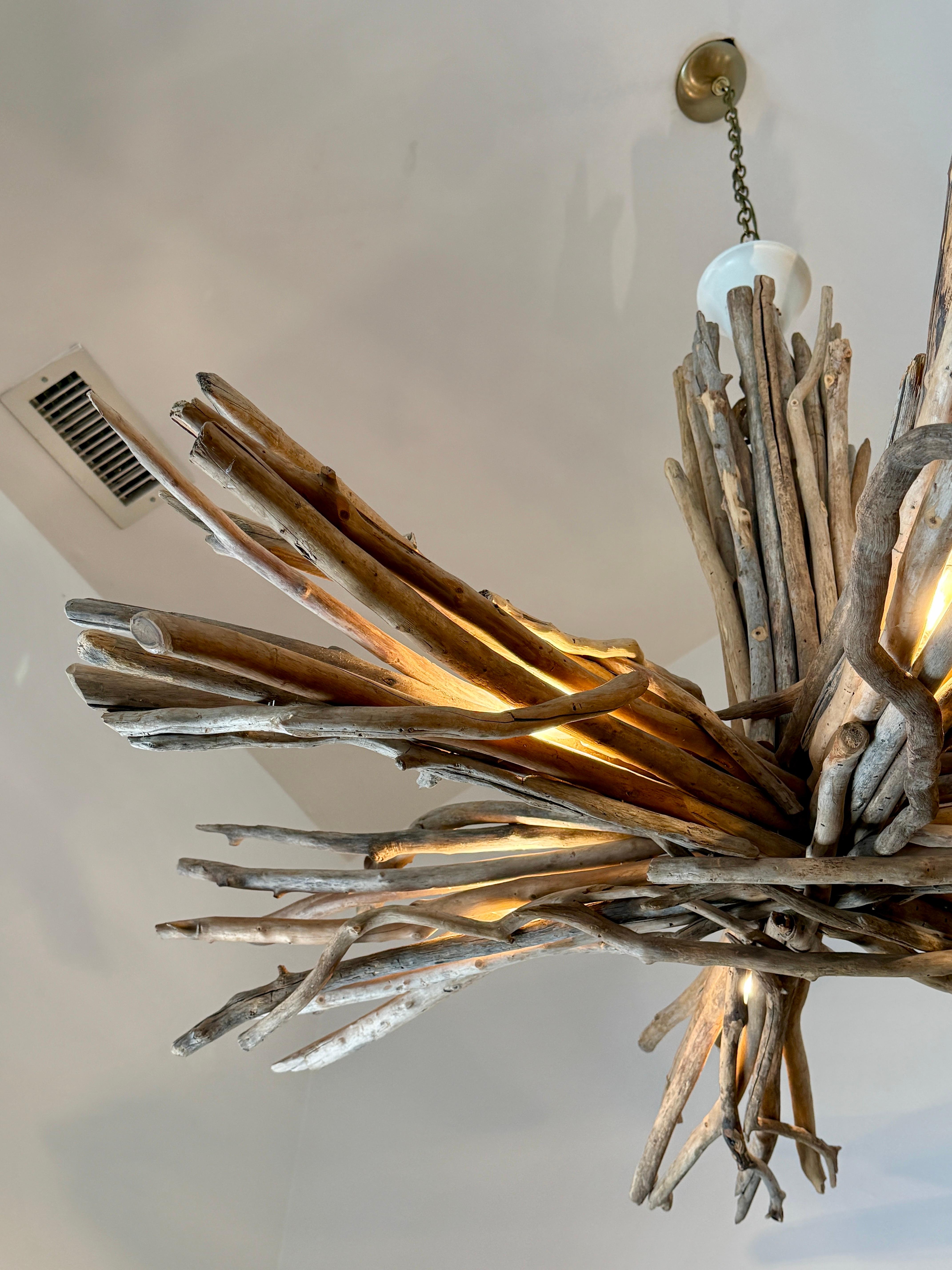 This perfectly whimsical driftwood chandelier is large scale and illuminated to all 6 arms.  Currently on a short chain and canopy BUT can be extended if needed.  Perfect for a beach house, ski chalet or organic decor.