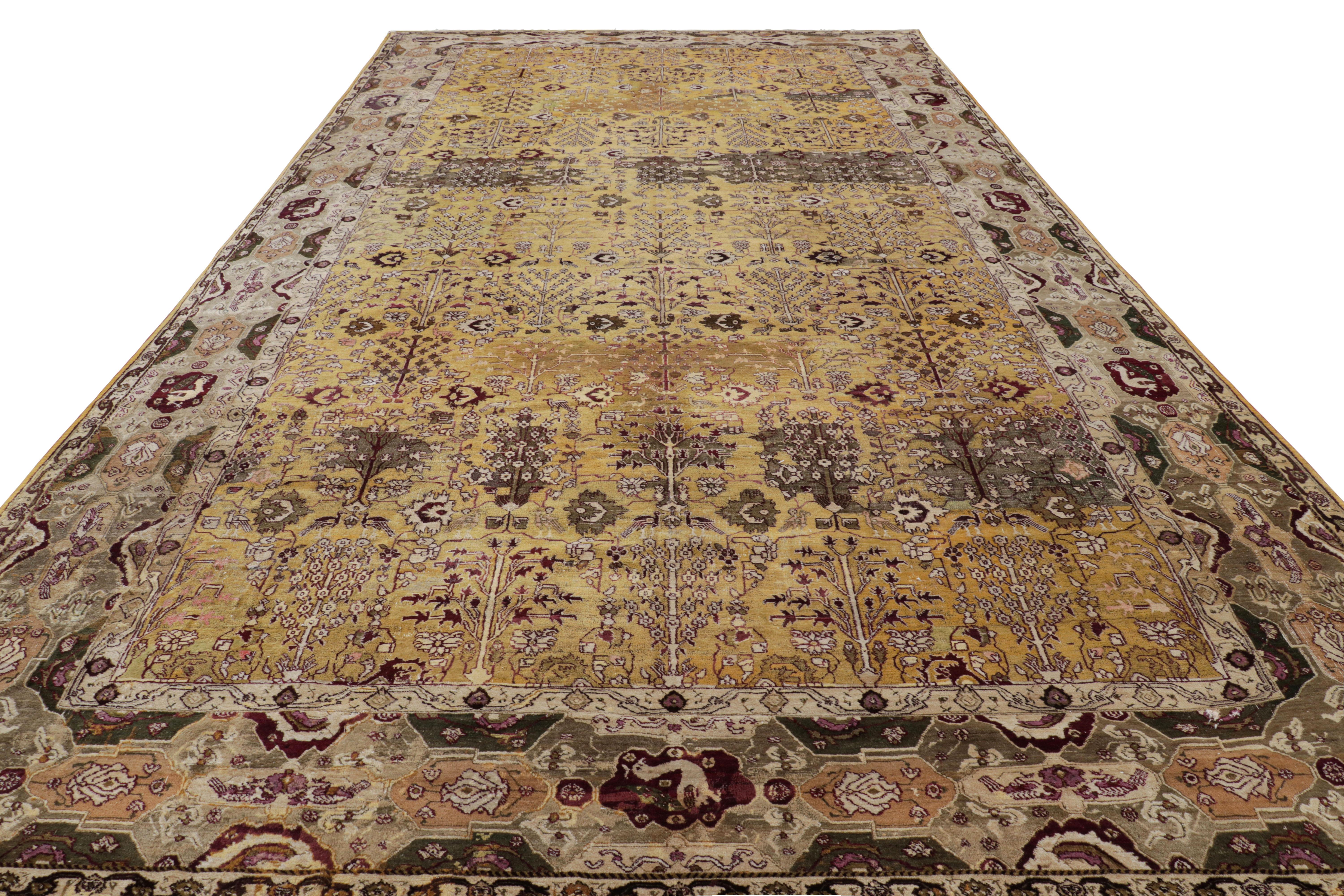 Made with hand-knotted wool in India, this 10x18 antique Agra rug is an extremely rare and exciting new oversized addition to Rug & Kilim’s curations of this celebrated weaving tradition. 

On the Design: 

This piece hosts a rich gold field