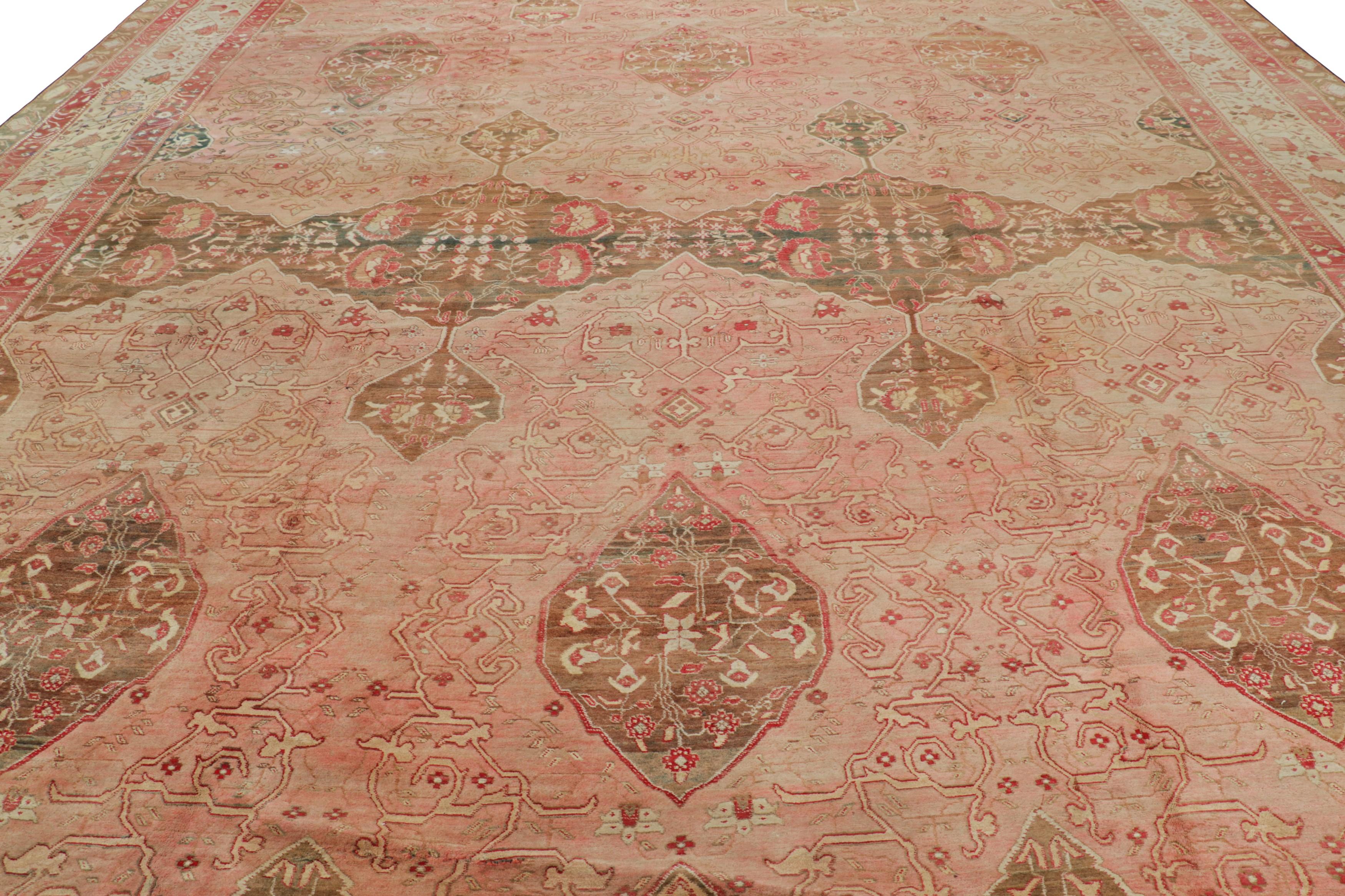 Made with hand-knotted wool in India circa 1920-1930, this 14x20 antique Agra rug is an extremely rare and exciting new oversized addition to Rug & Kilim’s curations of this celebrated weaving tradition. 

On the Design: 

Tones of peach and blush