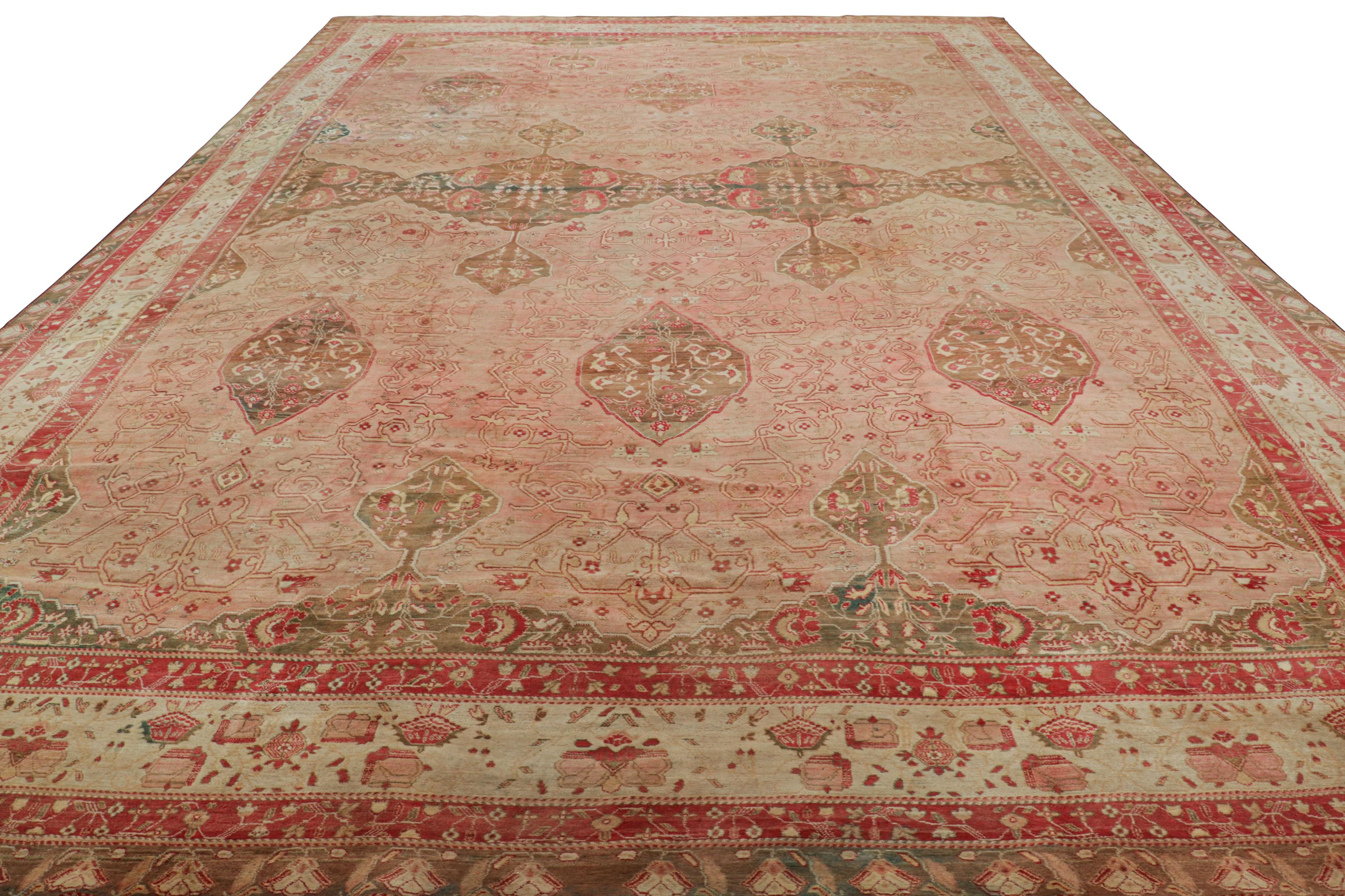 Oversized Antique Agra Rug in Pink and Brown with Floral Patterns  Rug & Kilim In Good Condition For Sale In Long Island City, NY