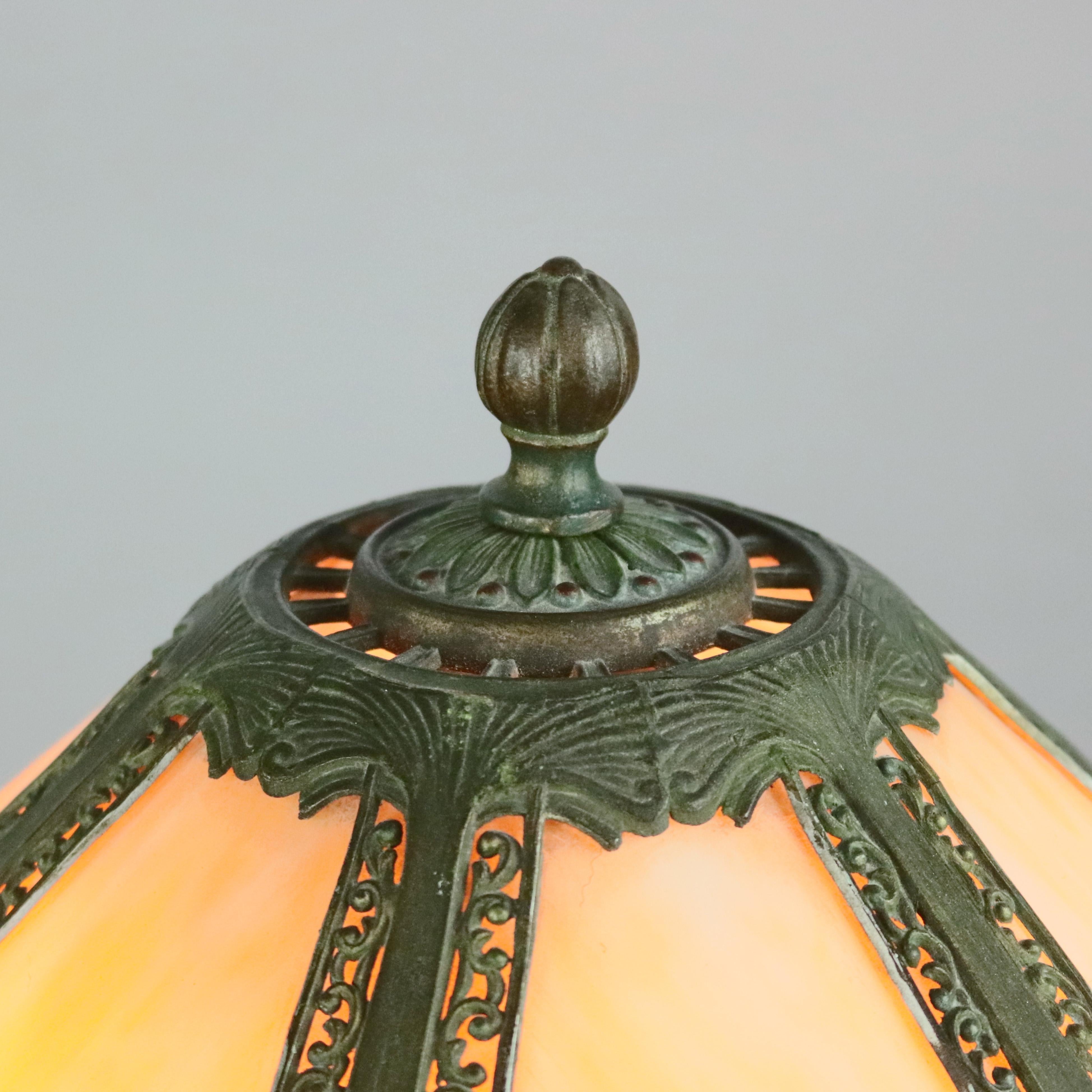 An oversized Bradley & Hubbard School table lamp offers cast metal and pierced shade housing six slag glass panels surmounting base with two independently controlled sockets, circa 1920

***DELIVERY NOTICE – Due to COVID-19 we are employing