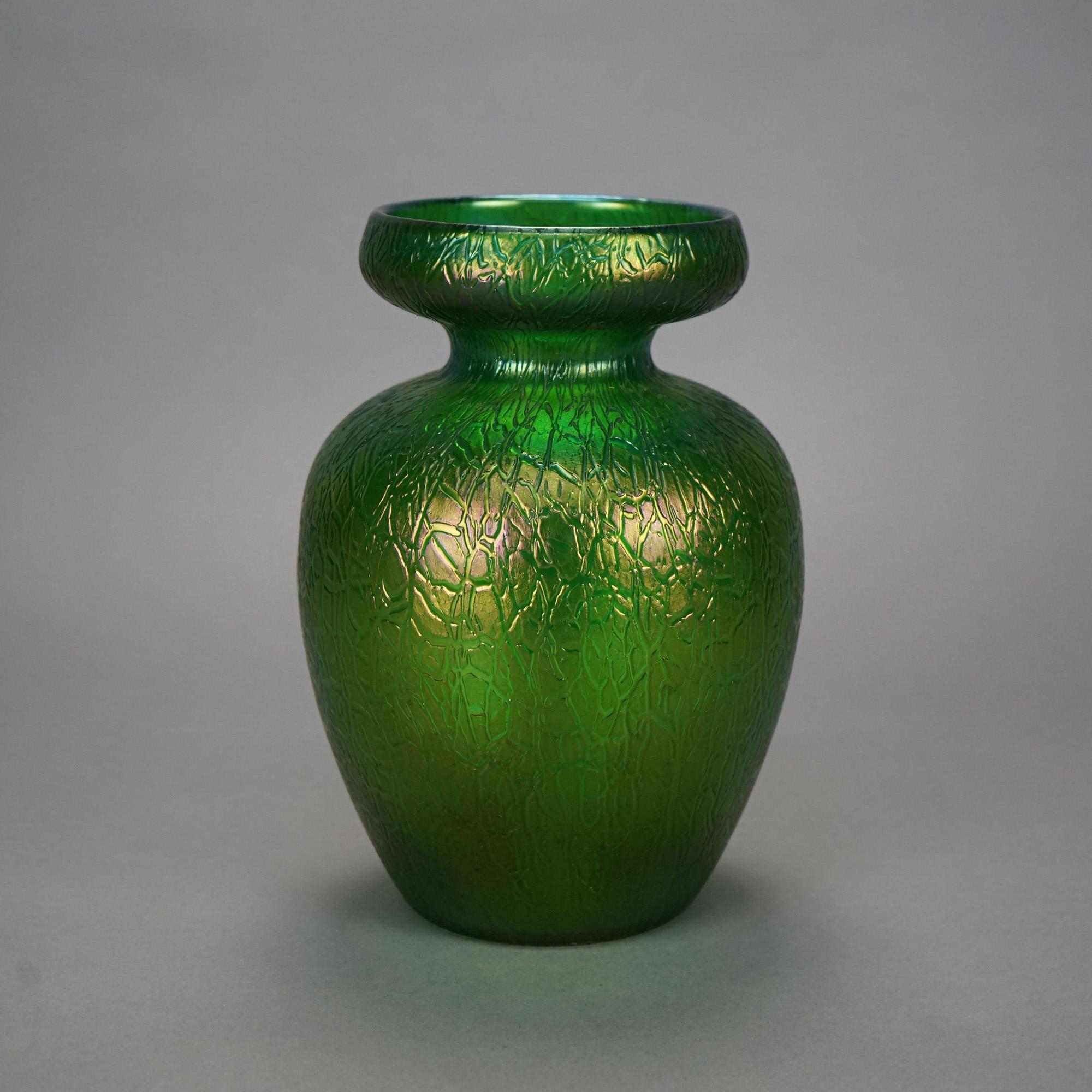 An oversized antique Loetz floral vase offers emerald green art glass construction with a modeled finish, c1910

Measures- 10.5'' H x 7.25'' W x 7.25'' D.