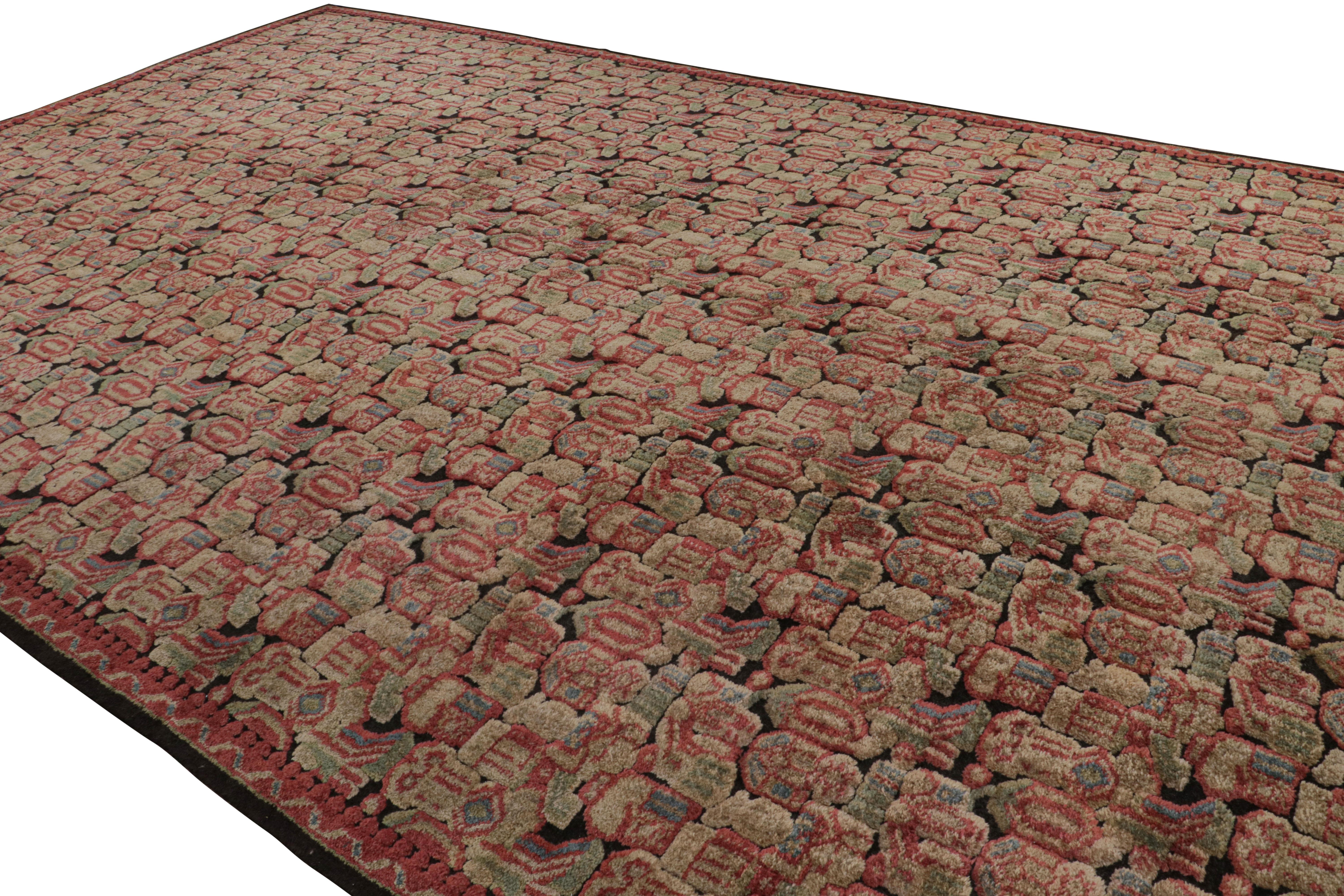 Hand-knotted in wool, an antique 12x20 oversized Axminster rug originating from England circa 1920-1930 - now joining our antique collection.

On the Design:

The piece enjoys beige-brown, red and green tones underscoring a geometric pattern married