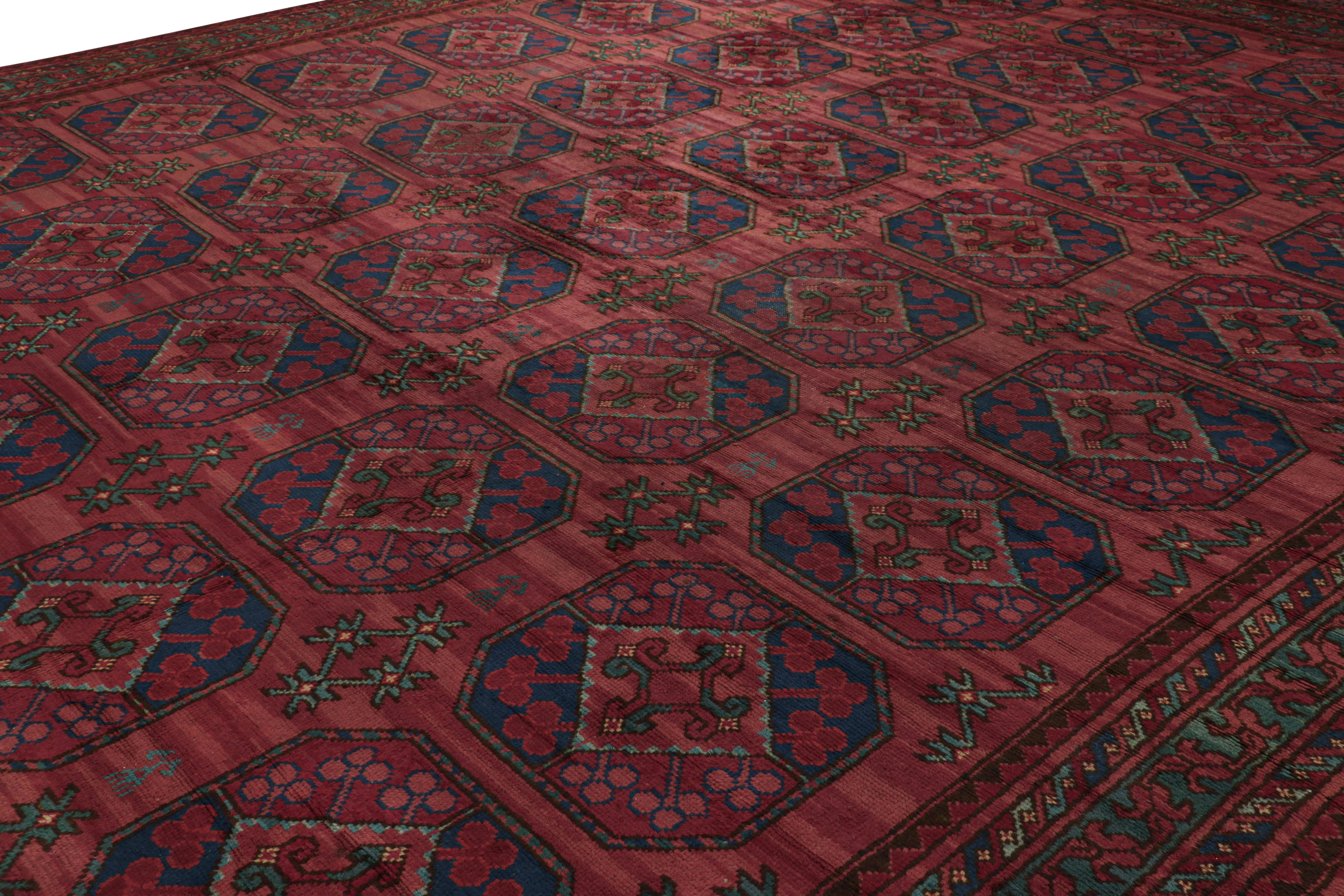 Hand-knotted in wool, this 16x23 Antique rug is a rare oversized curation believed to be of Bokhara provenance from Rug & Kilim’s coveted Antique collection.  

On the Design: 

A rich play of burgundy and raspberry tones underscore the field and