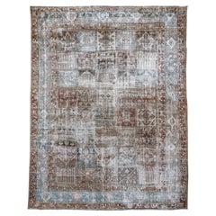 Oversized Antique Distressed Persian Baktiary Rug with Garden Panel Design
