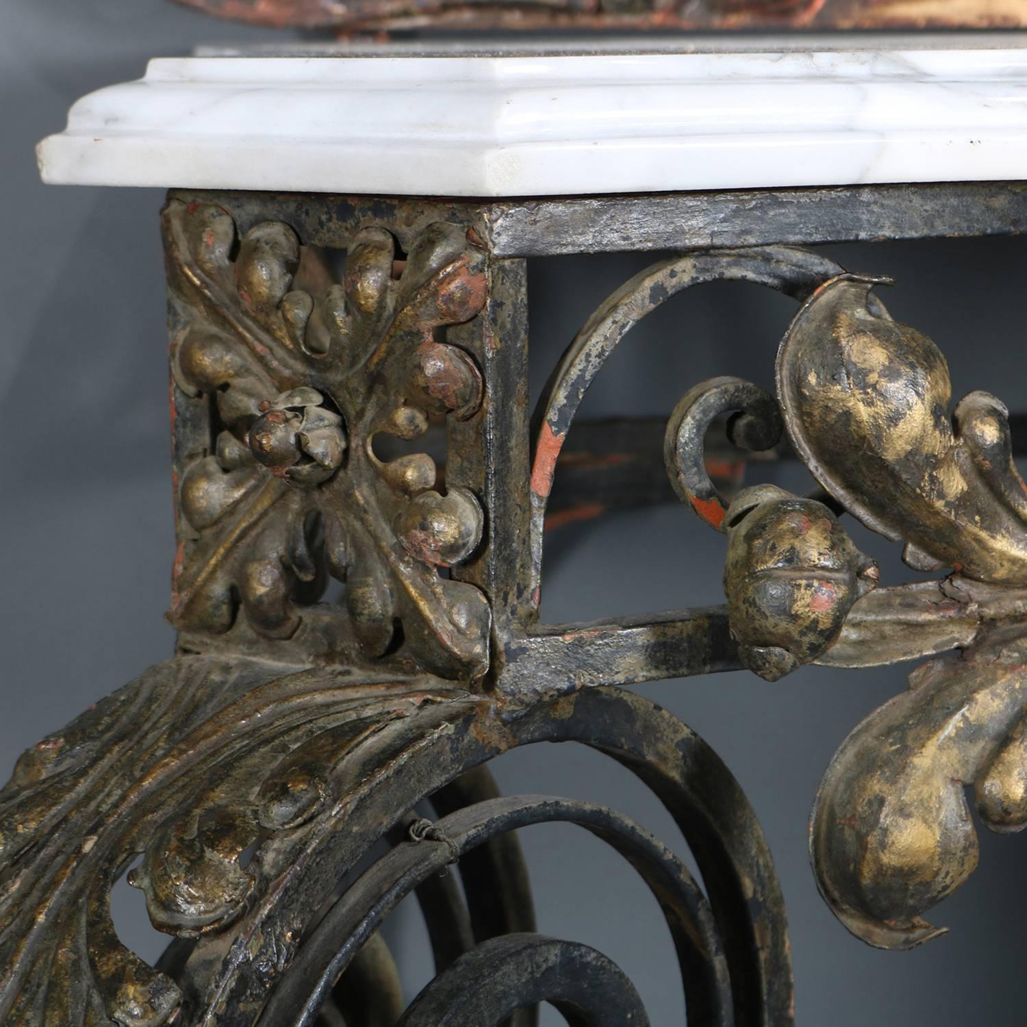 Oversized French Louis XIV French XIV console features marble top table with gilt metal base having scroll and foliate form apron and raised on scroll legs with acanthus knees, mirror with scroll and foliate form frame with central fleur-de-lis