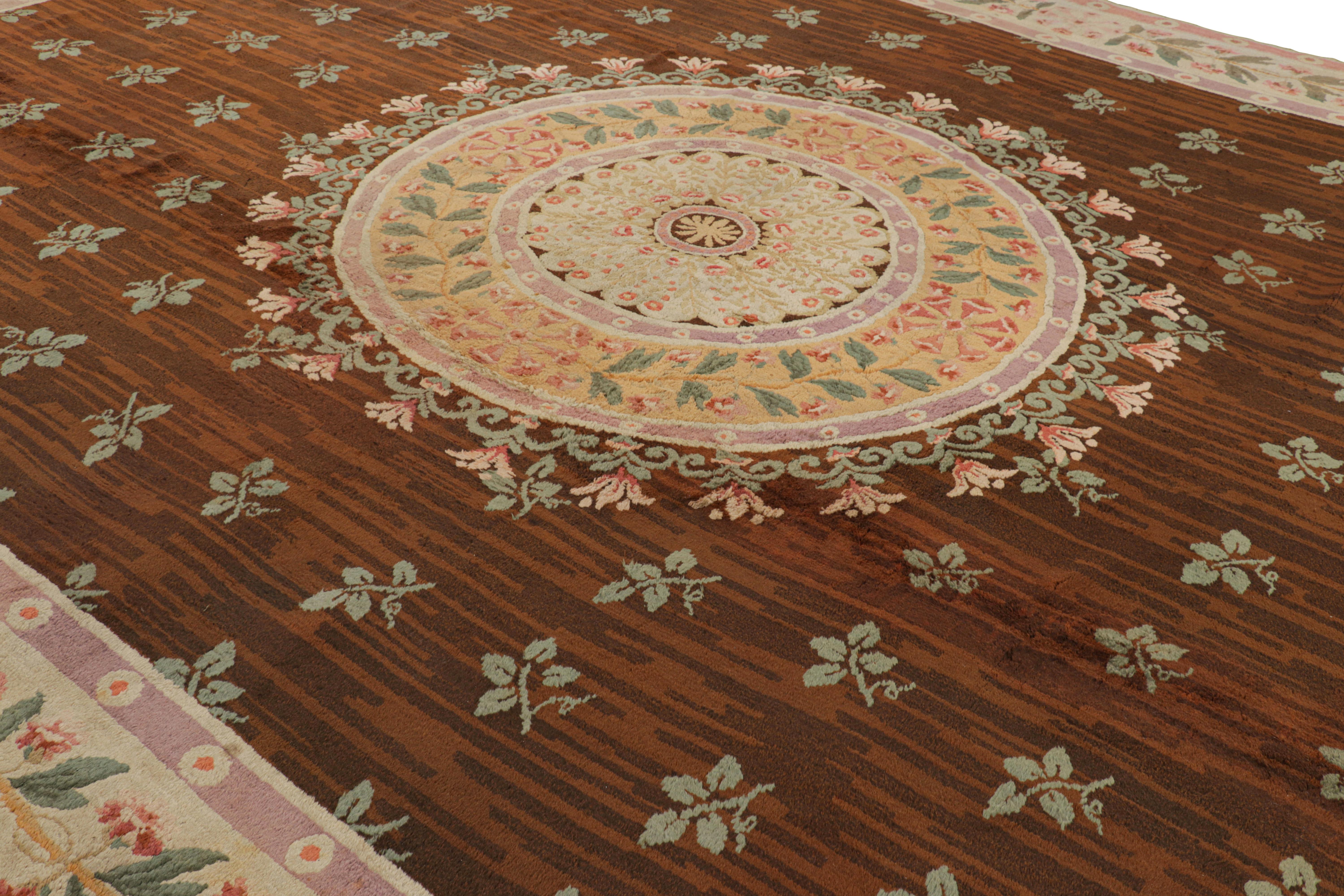 Hand-knotted in wool from France circa 1890, this 13x18 Antique French Savonnerie rug in the Neoclassical style is a rare masterpiece from our European rug collection. Its design enjoys floral patterns and an elegant medallion, as well as wide range