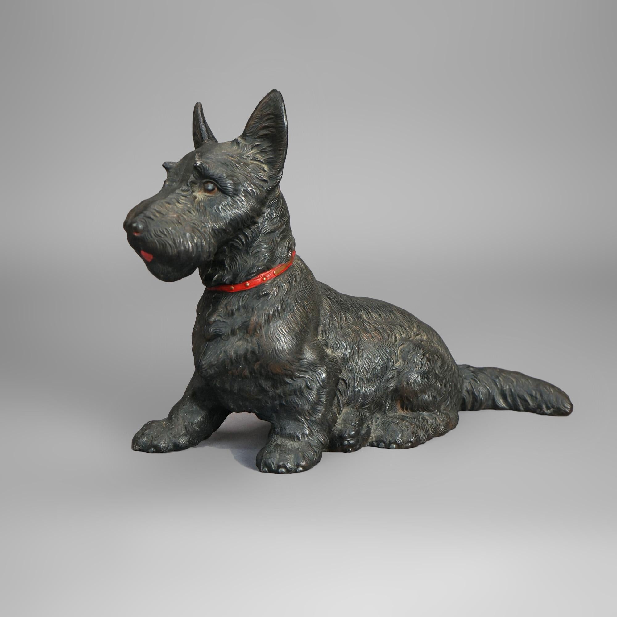 Oversized antique figural door stop in the manner of Hubley offers painted cast iron construction in the form of  a seated Scottish Terrier (Scottie dog); unsigned; c1900

Measures- 11.5''H x 6.25''W x 16''D