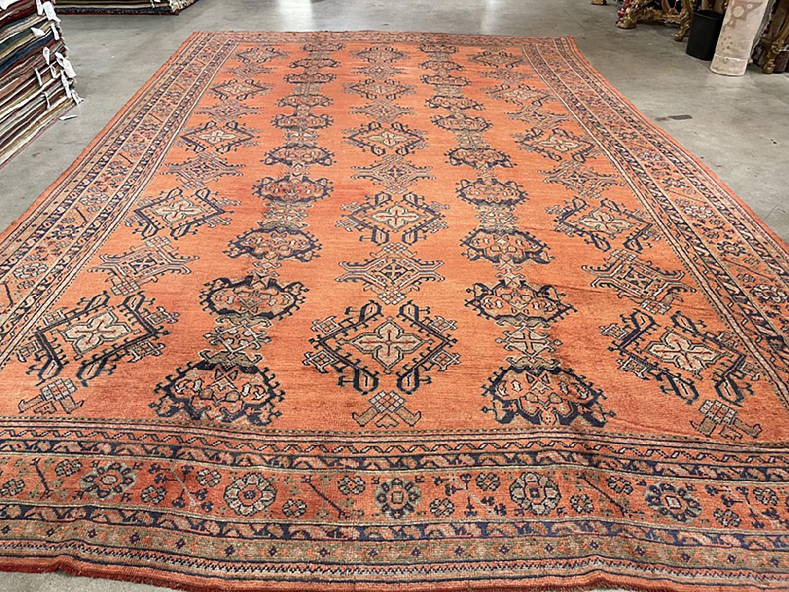 Oversized antique Oushak rug.

Measures: 13' x 20'.