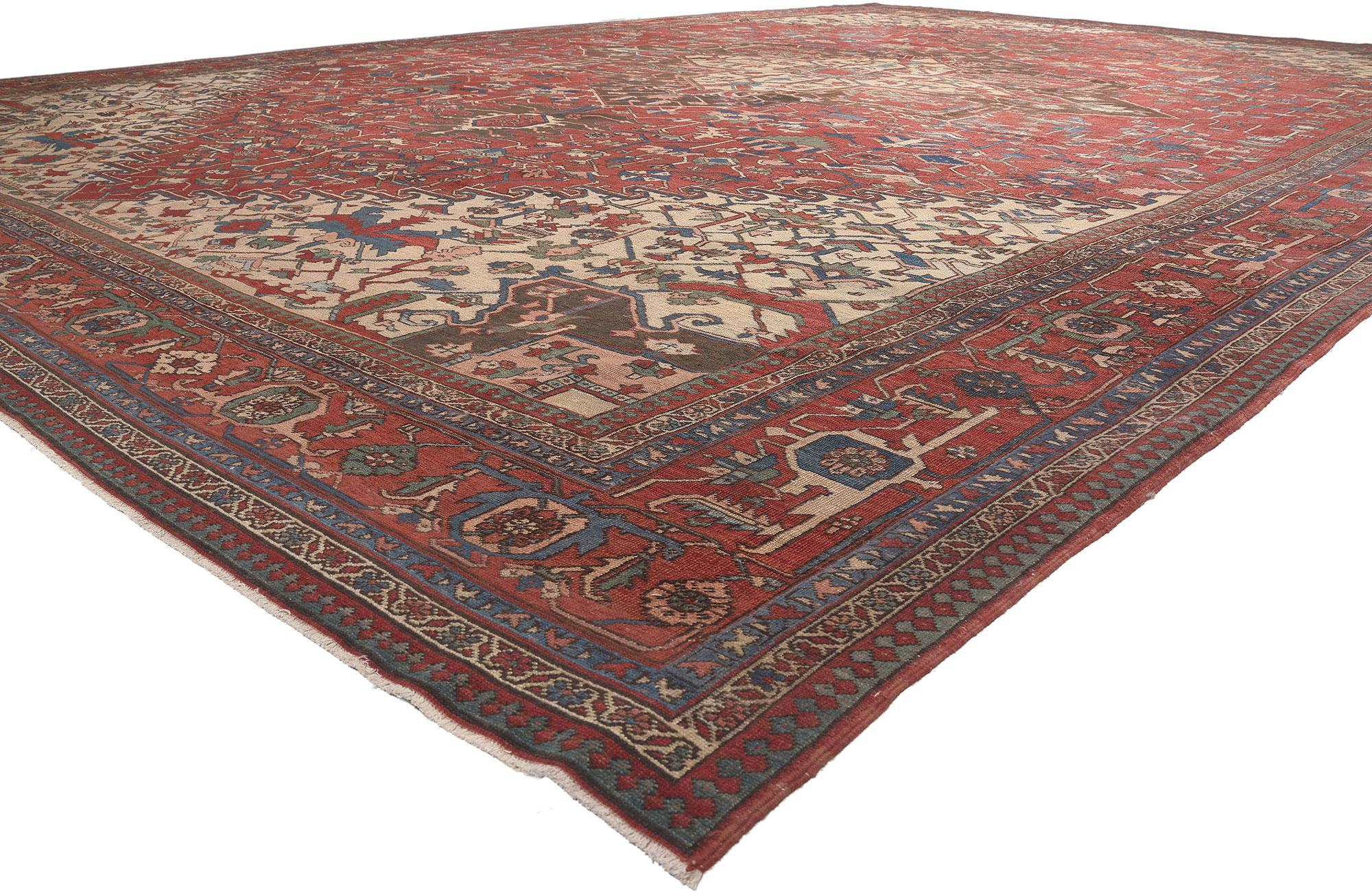 77525 Oversized Antique Persian Serapi Rug 16'00 x 24'01.
Warm and inviting with a timeless style, this oversized antique Persian Serapi rug charms with ease. The striking geometric design and refined color palette woven into this piece work