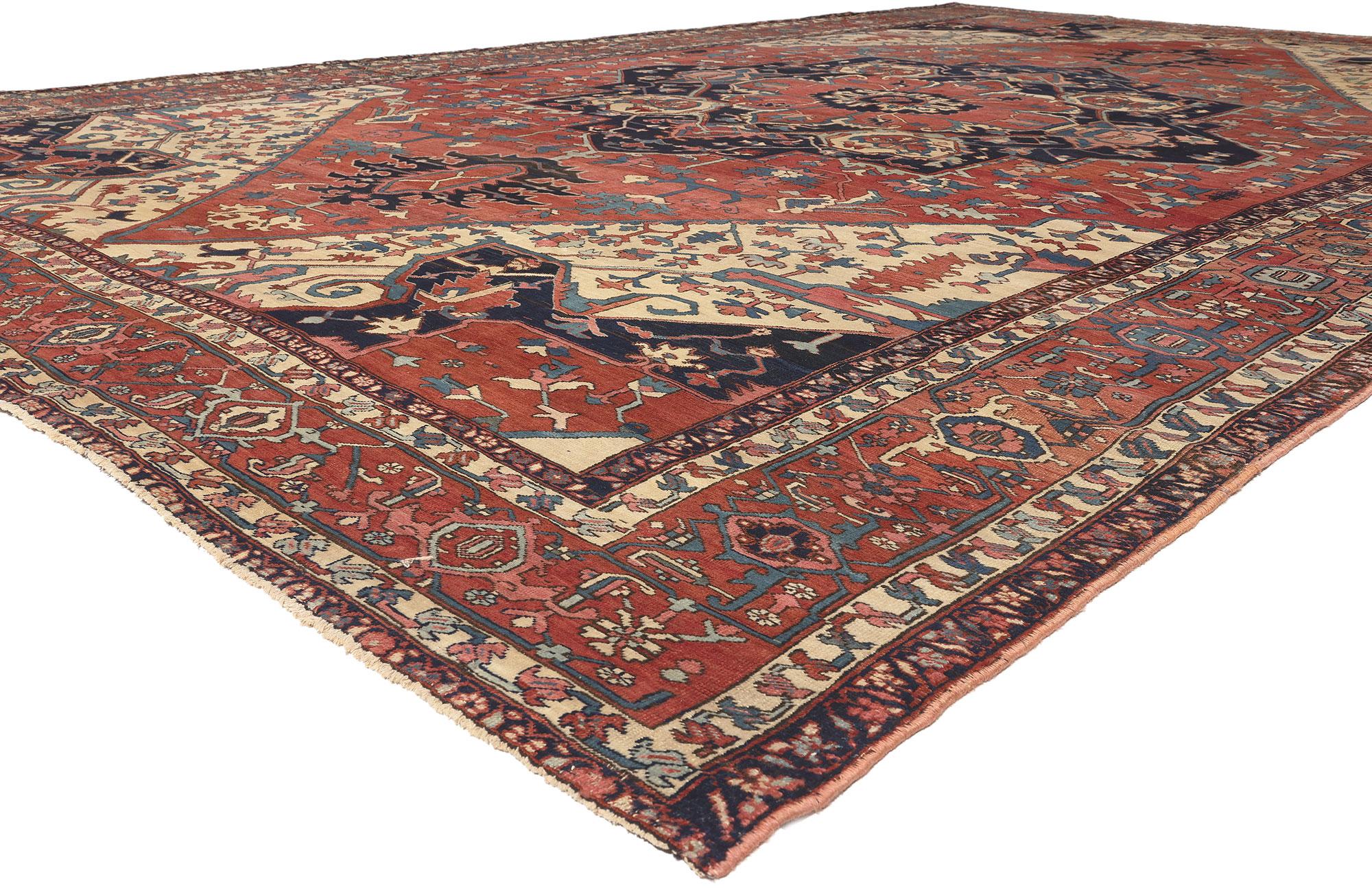 78650 Oversized Antique Persian Serapi Rug, 12'00 x 19'01.
Timeless appeal meets rustic charm in this hand knotted wool antique Persian Serapi rug. The intricate decorative detailing and sophisticated color palette woven into this piece work