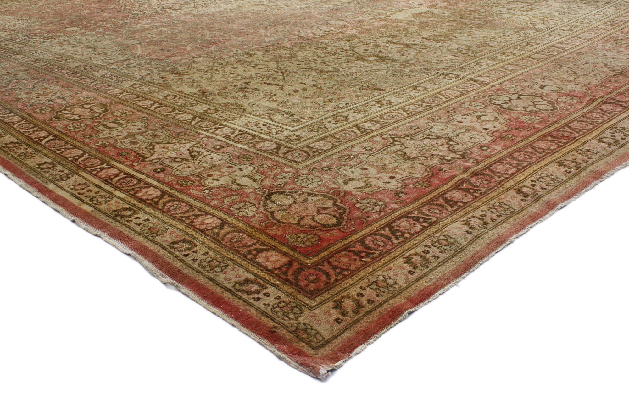 76770 Haji Kahlili Antique Persian Tabriz Rug, 15'04 x 20'07.
Emanating timeless style with incredible detail and texture, this oversized antique Persian Tabriz rug is a captivating vision of woven beauty. The intricate botanical elements and earthy