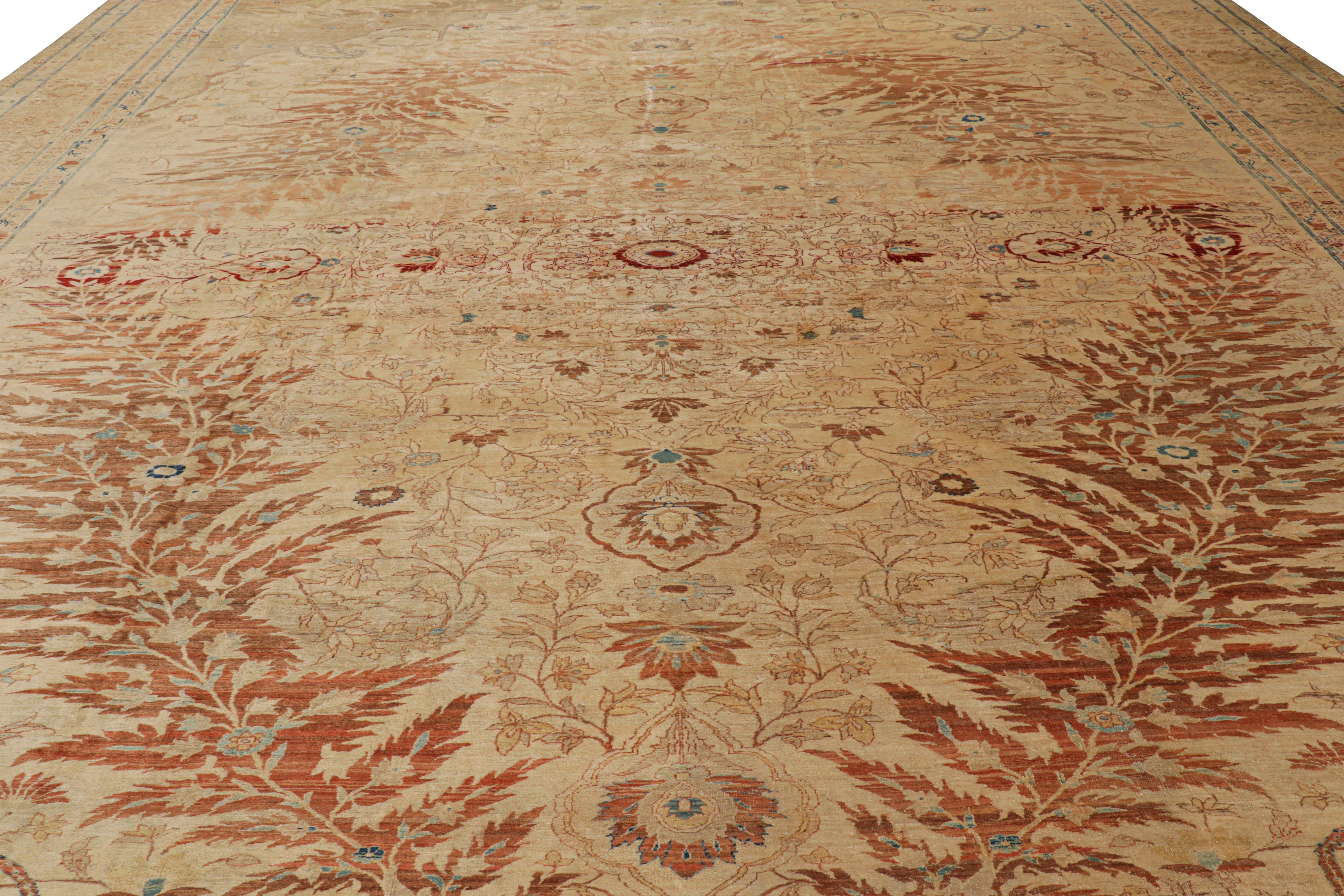 Hand-knotted in wool, originating from , circa 1910-1920, this 15x19 special Persian Tabriz rug features geometric patterns and a large-sized medallions in primarily gold, beige/brown, red and blue tones. 

On the Design

Connoisseurs will admire