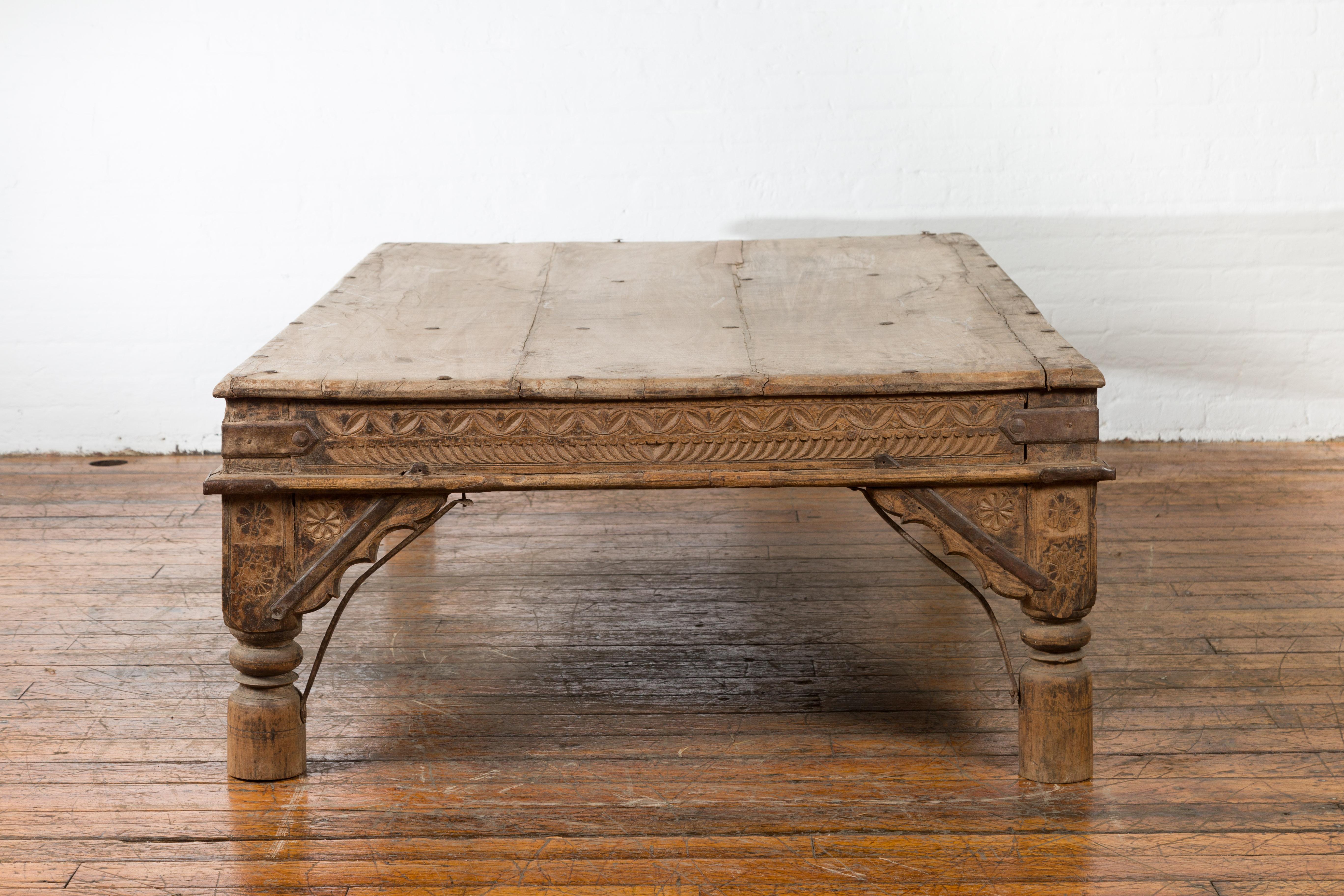 Oversized Antique Temple Door with Studs Made into a Carved Coffee Table 4